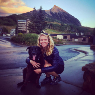 Jenny Fitzgerald, Employee Of Gallery Wild In Downtown Jackson Hole, Poses With Her Dog