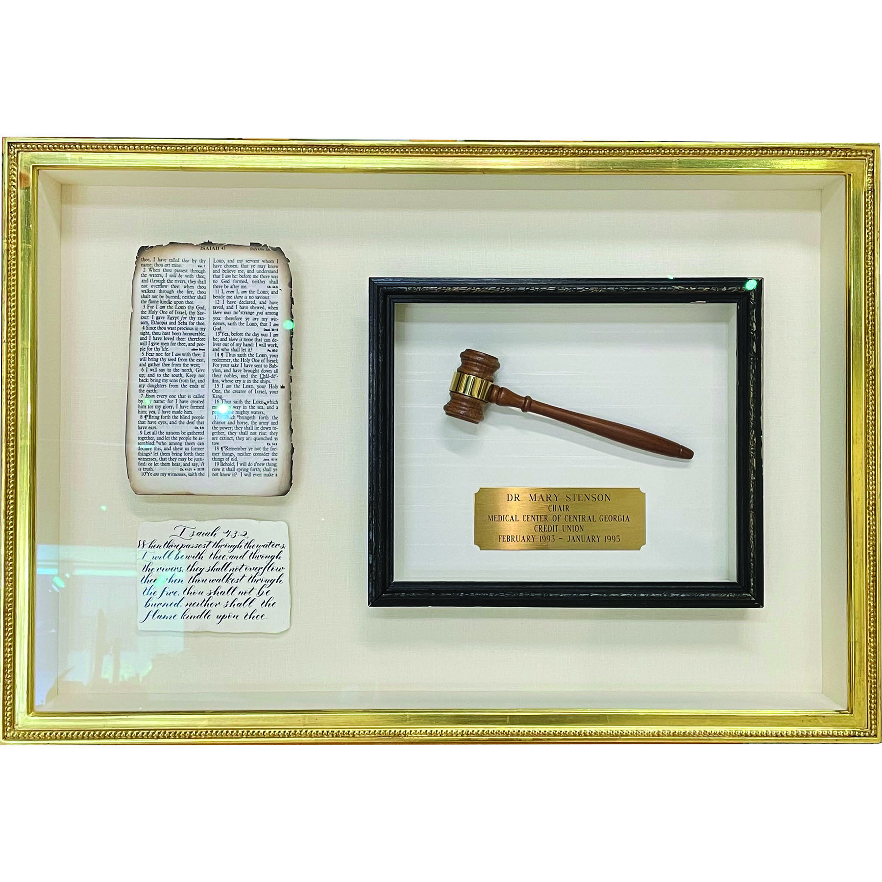 Gavel and papers in a gold custom frame