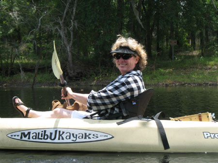 Artist Eleanor Blair kayaking on a Florida river