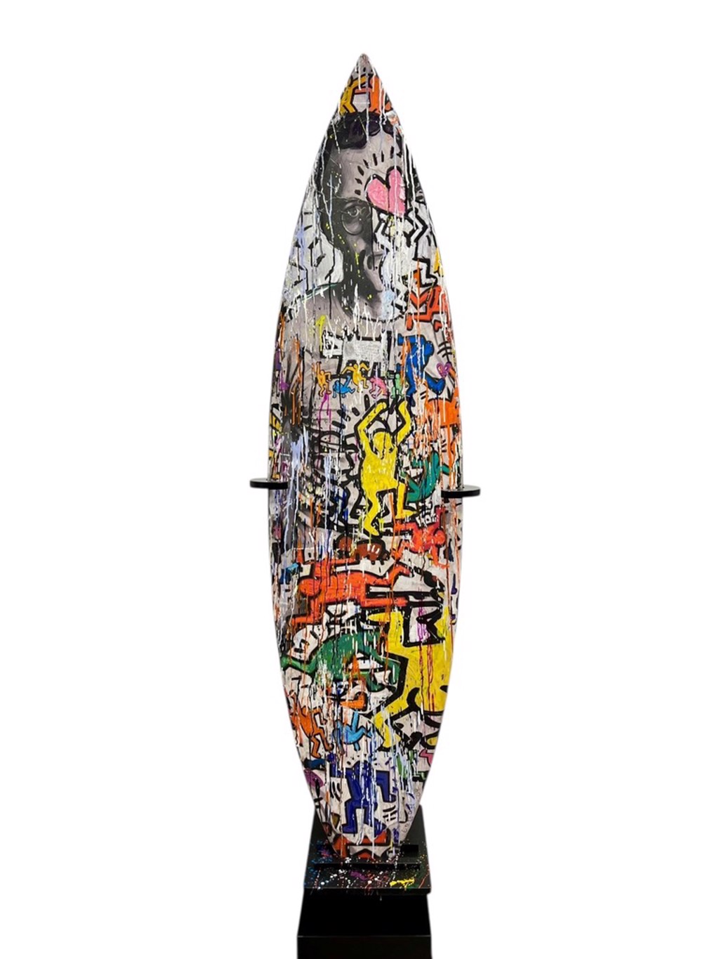 Andrew Cotton Haring Surfboard: surfboard covered with colorful outlined figures, layered marks, and a portrait near the tip.