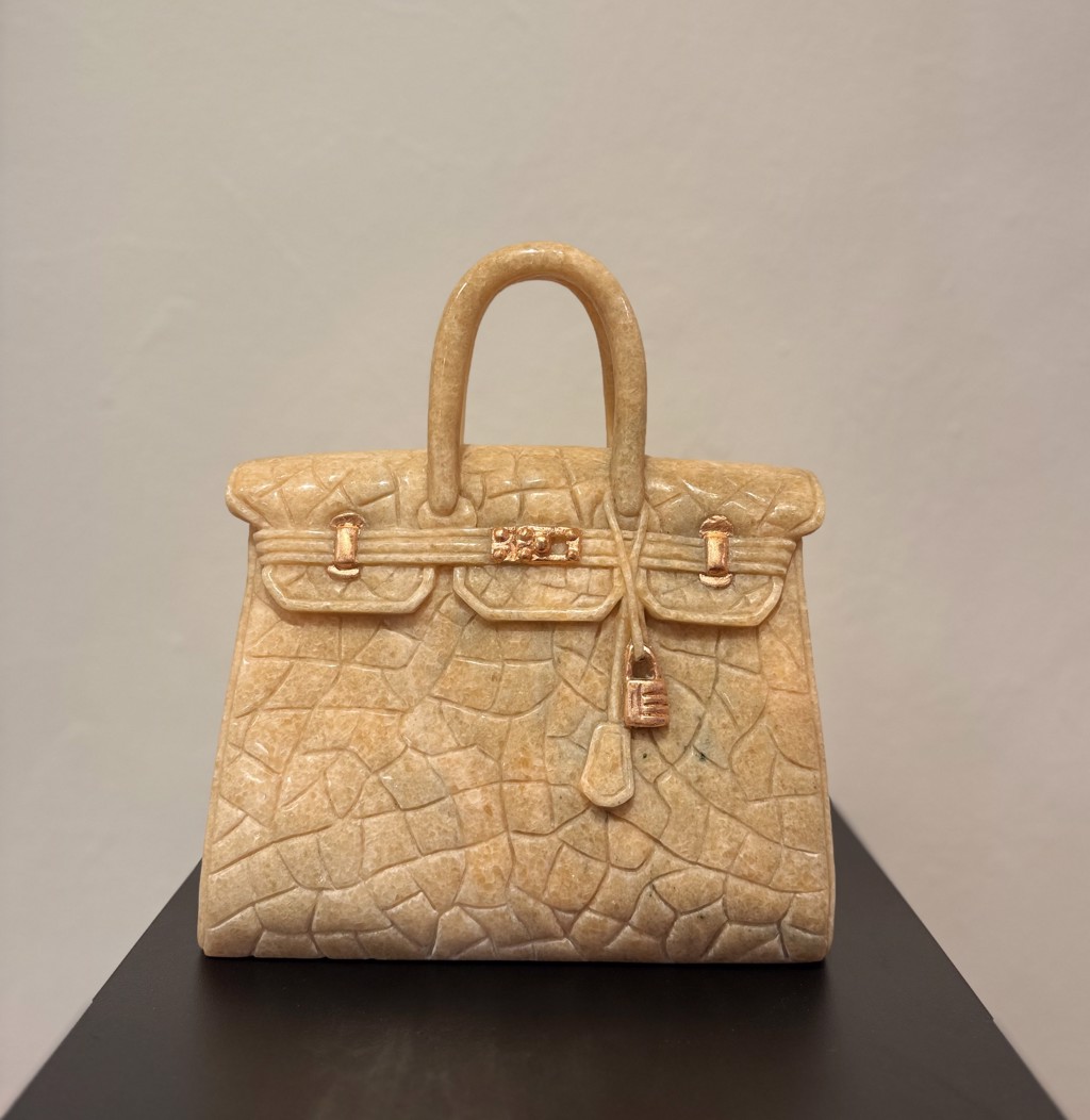 Ayden Snider Hermes Marble Birkin 25 RG: beige marble handbag sculpture with crocodile-pattern carving, rounded handles, and rose-gold-toned hardware.