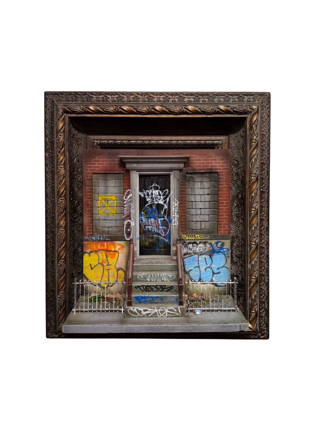 Danny Cortes Brooklyn Abandoned Series: miniature abandoned brick entrance with boarded windows, a stoop, and colorful graffiti.