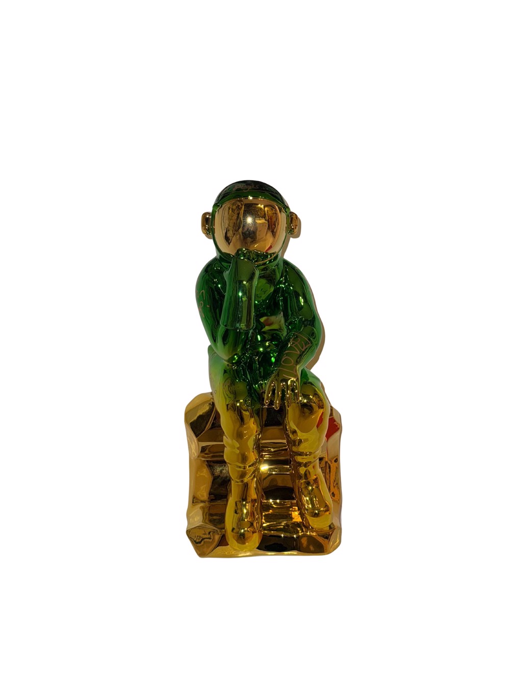 Brendan Murphy The Thinking Spaceman: seated green and gold-toned astronaut resting a hand beneath its helmet on a gold-toned seat.