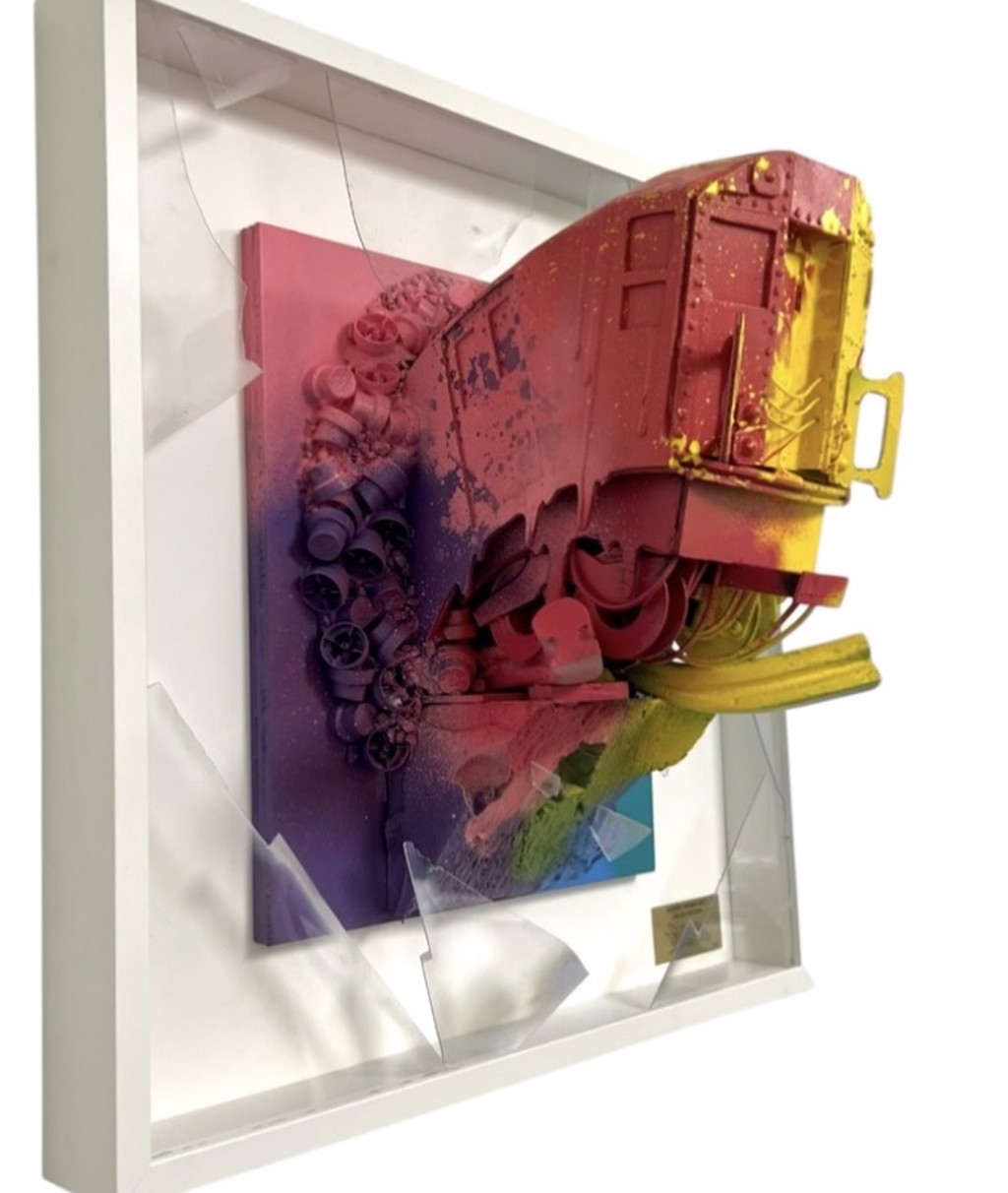Orus Subway Series NYC (Multi Color) 030: pink-and-red subway sculpture with a yellow front and rails against a multicolored panel.