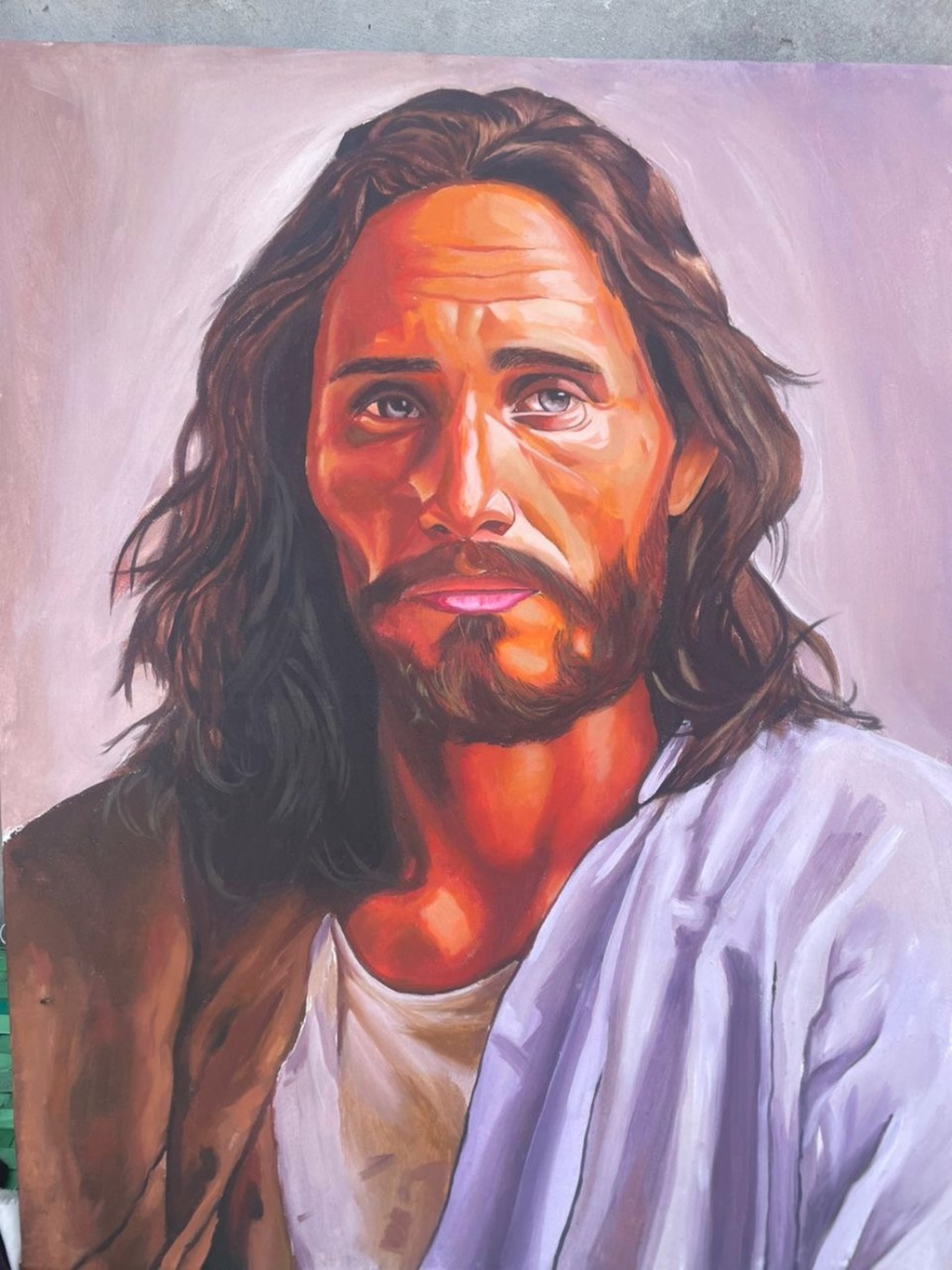 Bonu Deji The Watchful Savior: Bearded, long-haired figure with a warmly lit face and pale robes against a lavender background.