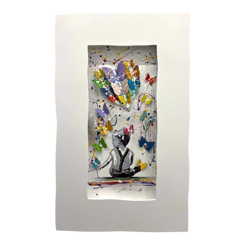 Oz El Hai Never Give Up: seated child viewed from behind beneath colorful dimensional butterflies and looping paint lines in a white frame.
