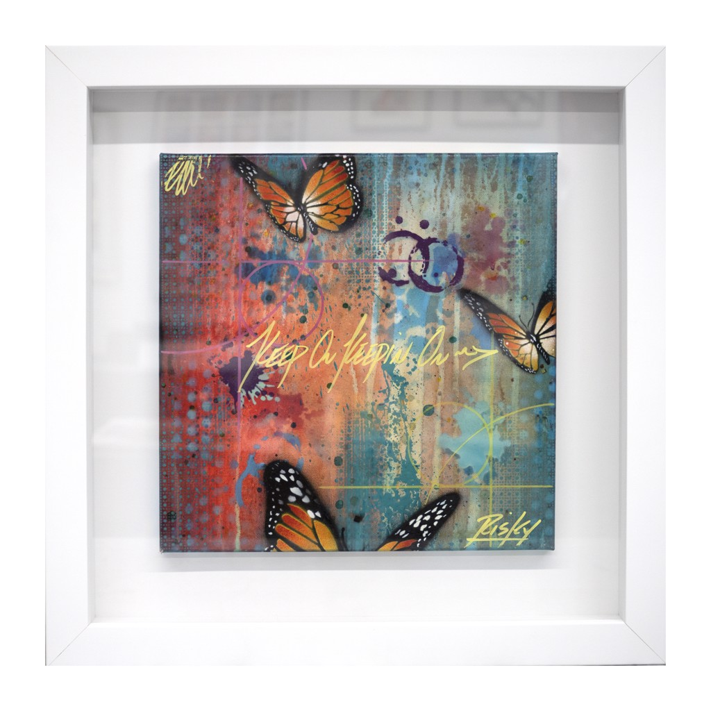 RISK Keep On Keeping On: Orange butterflies over layered red, turquoise, and yellow paint with lettering and drips, shown in a white frame.