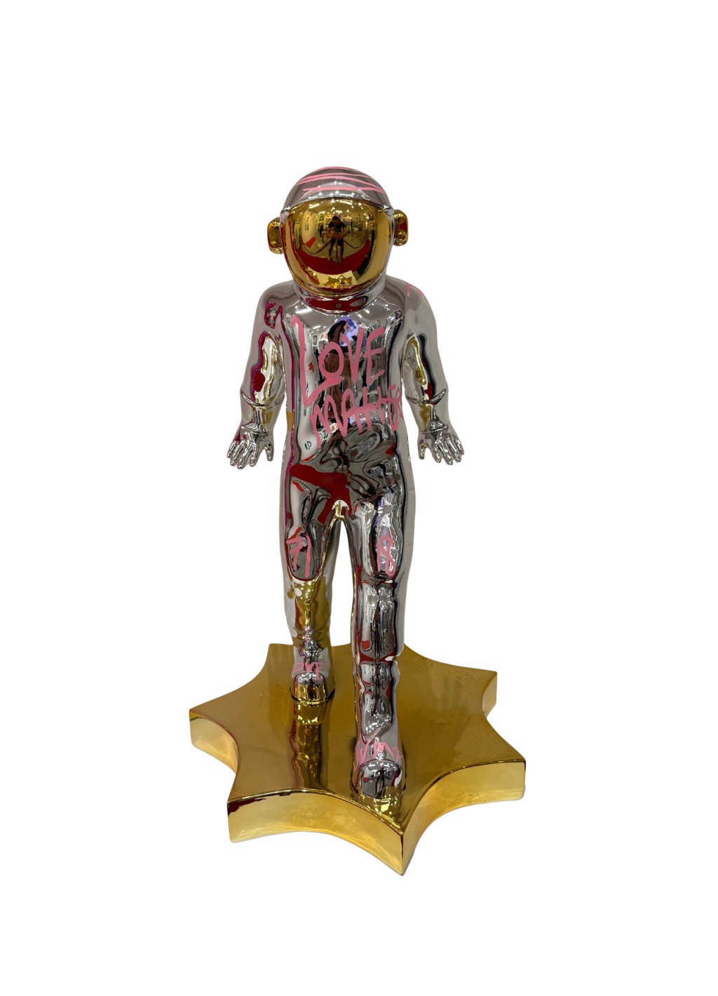 Brendan Murphy Magic: silver-chrome astronaut with pink handwriting, gold-toned visor, and star-shaped base.