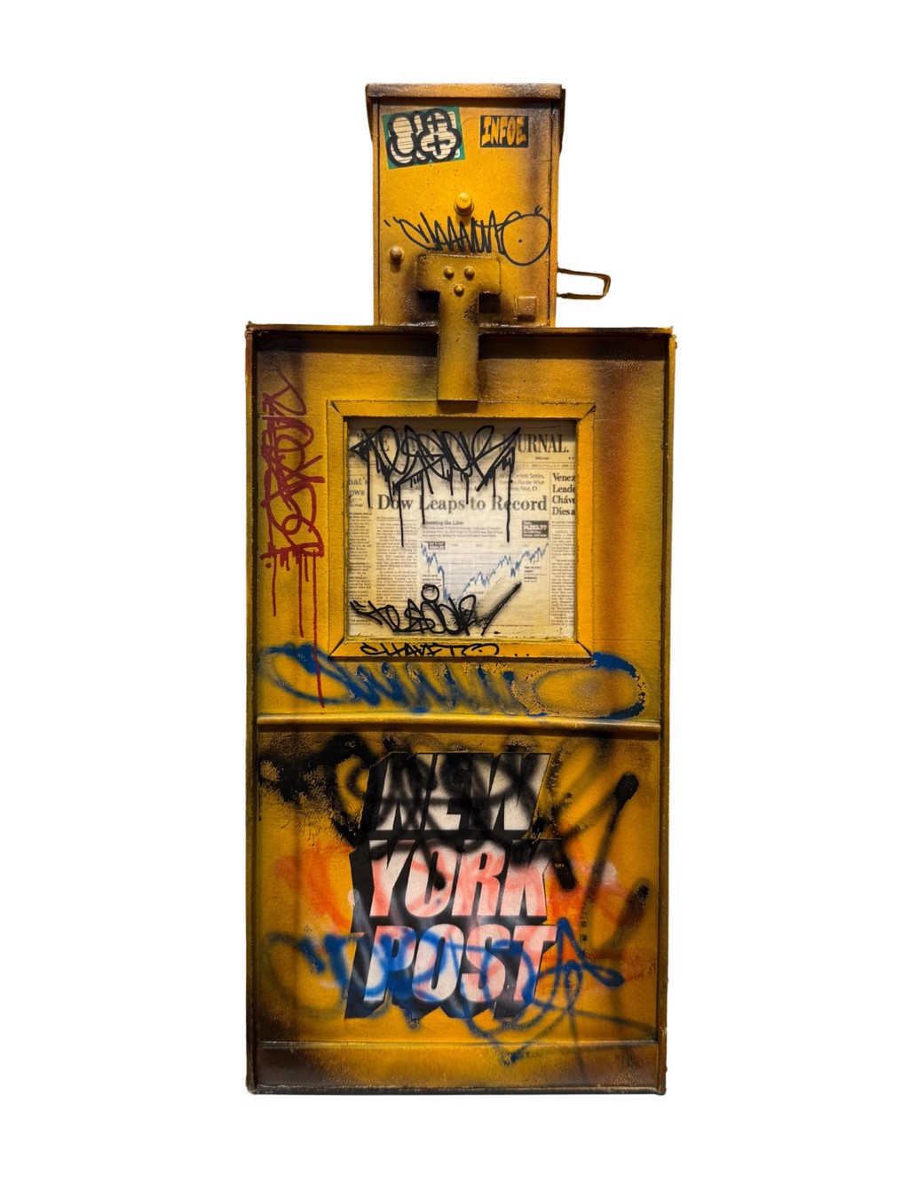 Danny Cortes NewsPaper Box: yellow miniature newspaper vending box with graffiti, stickers, and a newspaper behind the window.