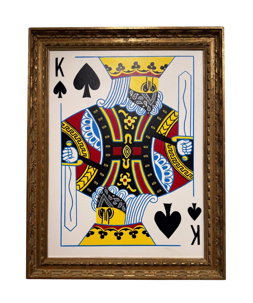 Kest Gak King of the Streets: King of Spades playing-card figure with colorful clothing and black suit symbols, shown in an ornate gold-toned frame.