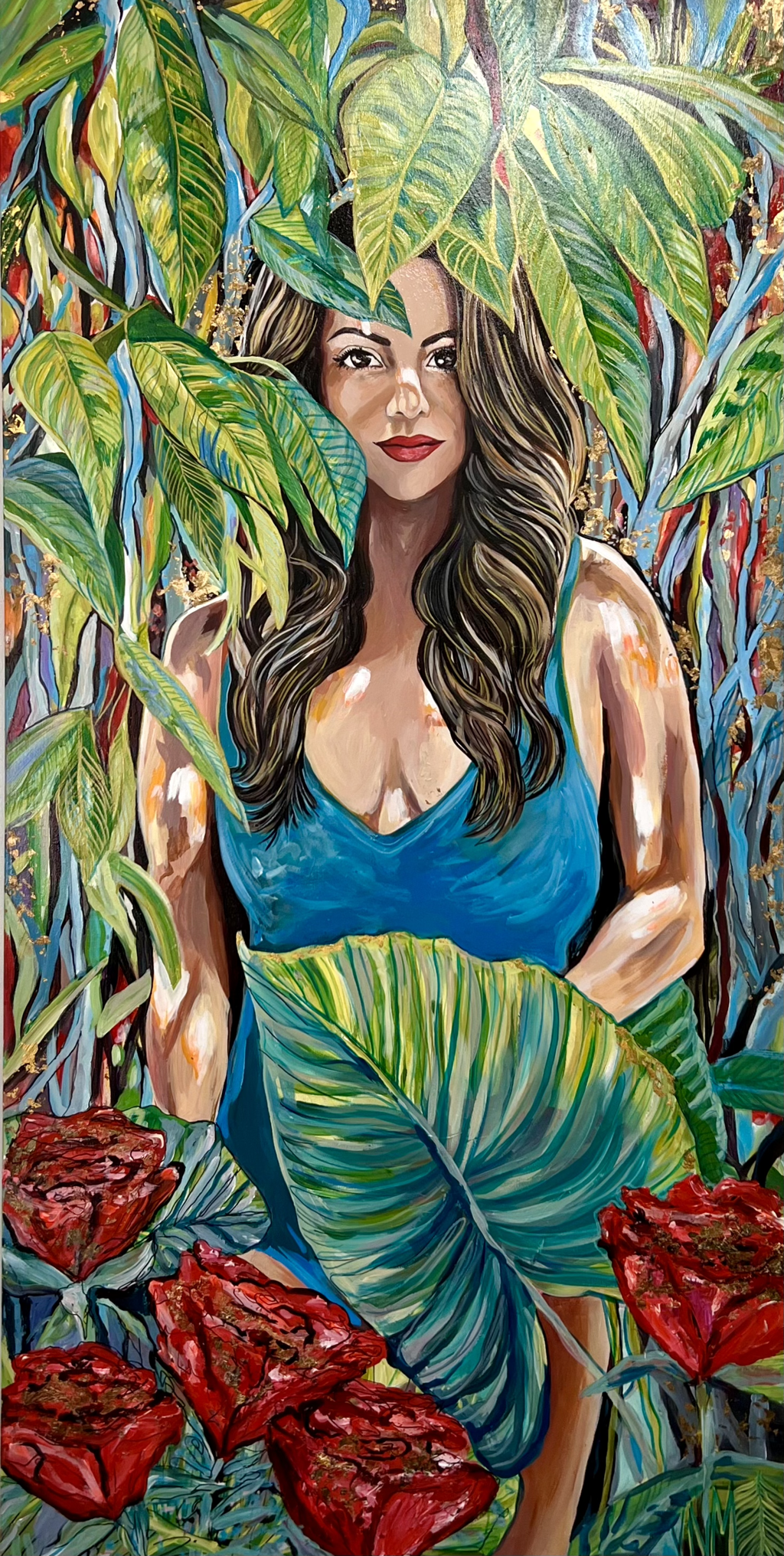 Julianne Marangi Soledad "Lady in the Leaves": dark-haired woman in a blue dress surrounded by large green leaves and red flowers.