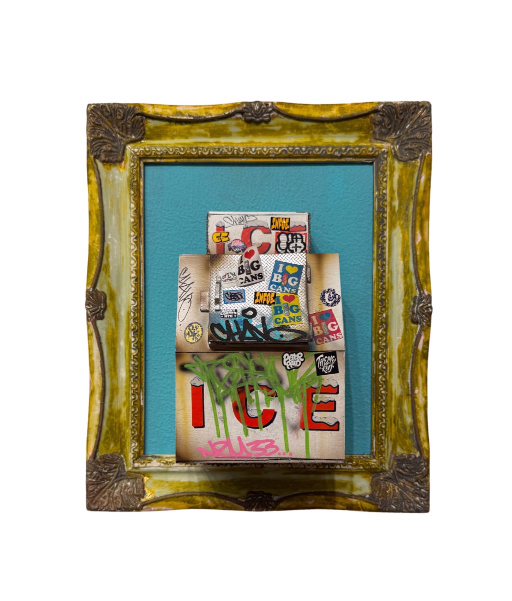 Danny Cortes Original Ice Box: miniature sticker-covered ice box with green graffiti against turquoise inside an ornate gold-toned frame.