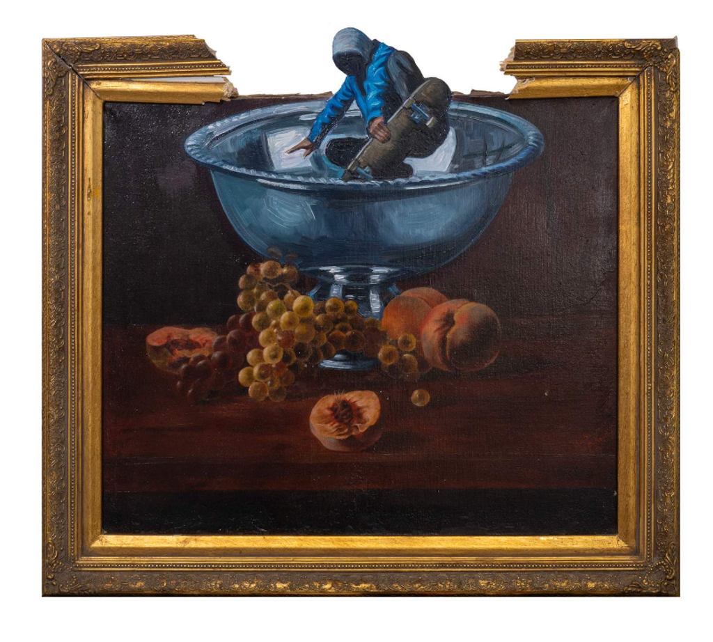 Hijack Still Skating: skateboarder emerging from a blue bowl above grapes and fruit, extending through a gap in an ornate gold-colored frame.