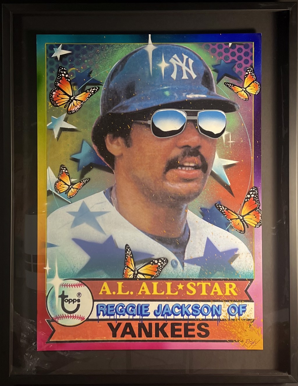 RISK Risk Topps Project 70 "Reggie Jackson": Reggie Jackson wearing a Yankees helmet and mirrored sunglasses with orange butterflies, blue stars, and an All-Star banner.