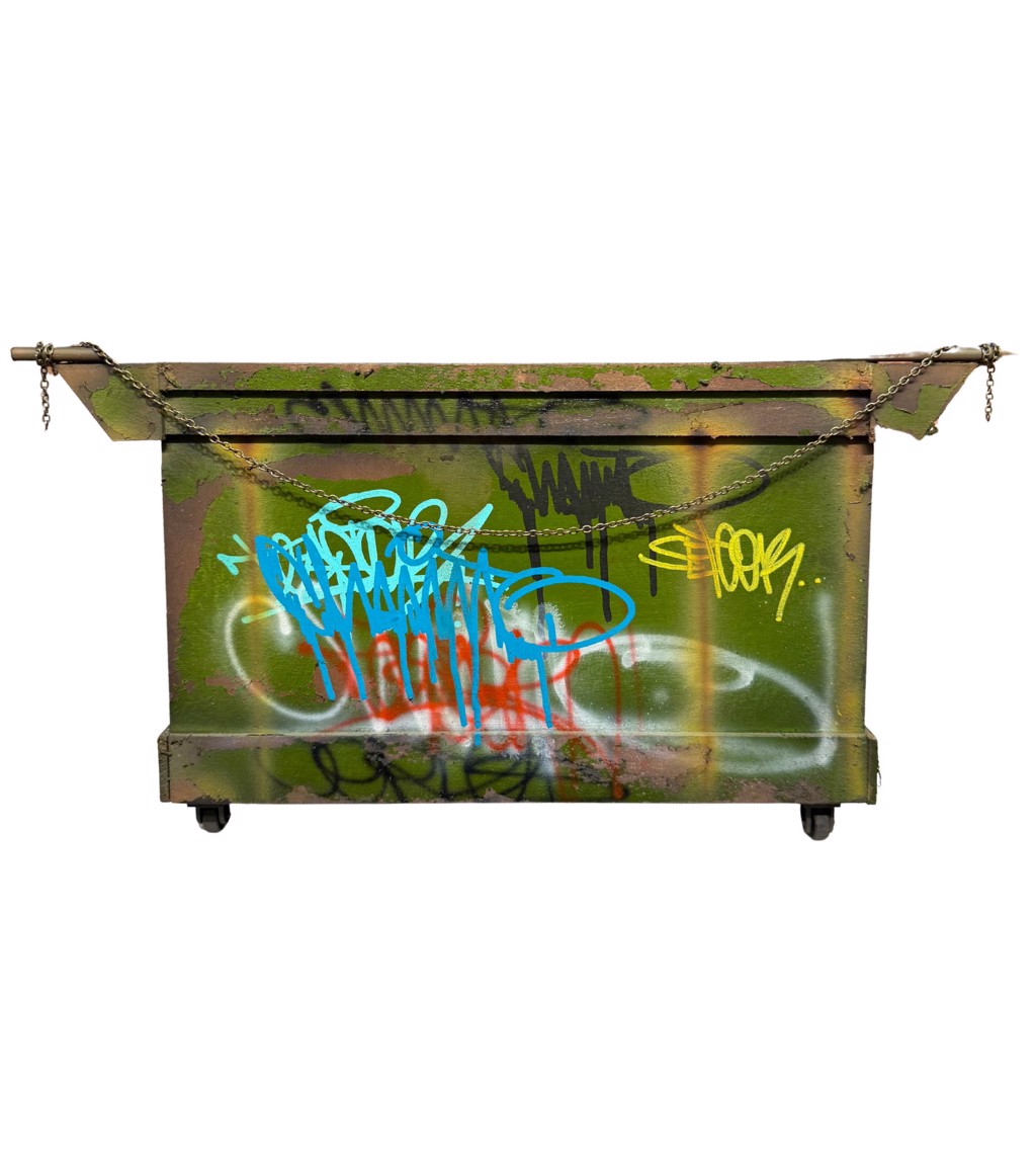 Danny Cortes Large Green Dumpster: weathered green miniature dumpster with colorful graffiti, small wheels, and a draped chain.