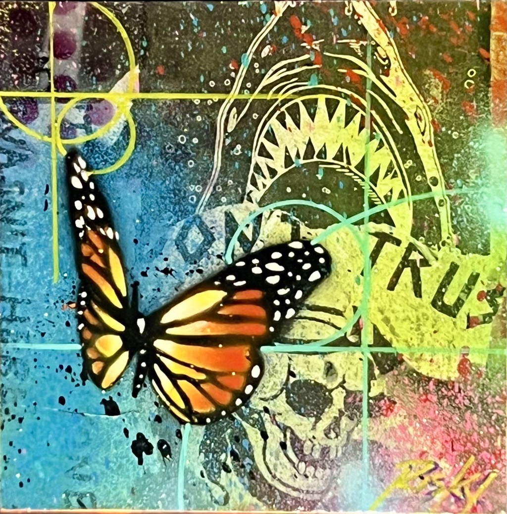RISK DTA Shark x Travis Barker: Orange butterfly, shark mouth, and skull over a turquoise, yellow, and pink layered background.