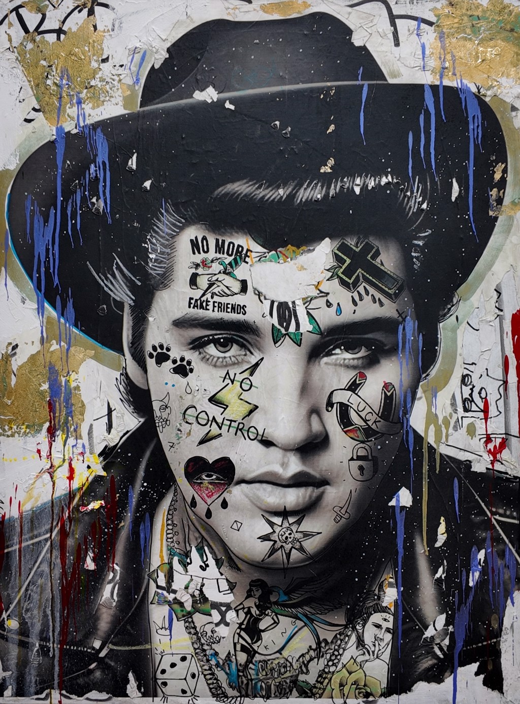 Andrew Cotton Rebel Gold: portrait in a black hat with tattoo-like symbols, blue drips, and gold-toned patches.