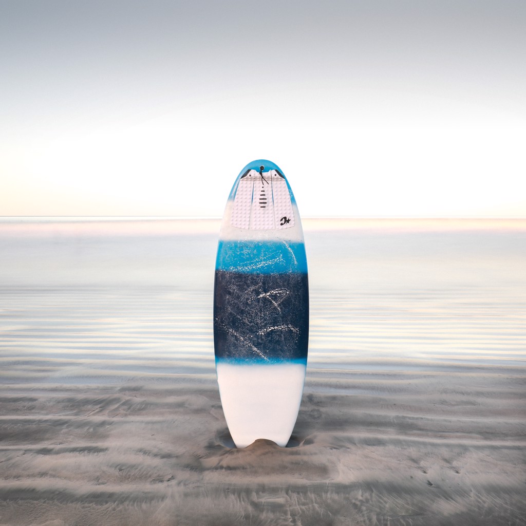 Striped Surfboard at Nosara Beach by Keith Ramsdell
