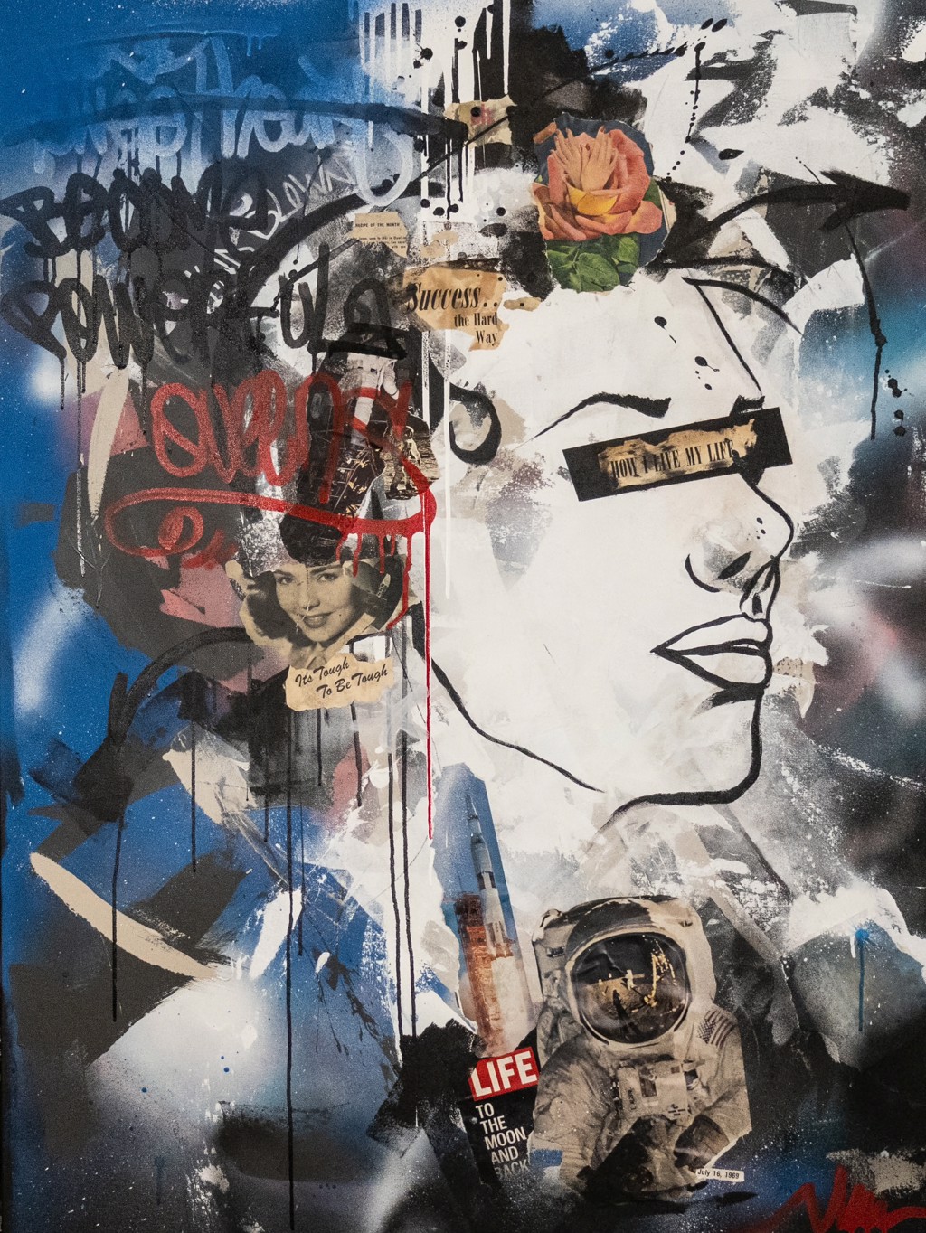 Josephine Giordano It’s Tough To Be Tough: outlined face amid blue and black graffiti, magazine fragments, and a rose.