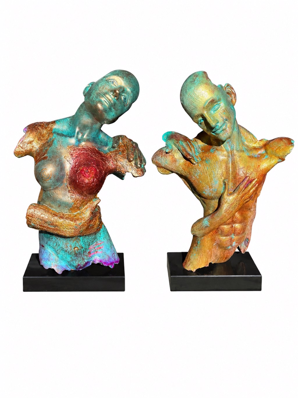 Matthew Snider What Remains: two partial torso sculptures with tilted heads, multicolored textured surfaces, and crossed arms on separate black bases.