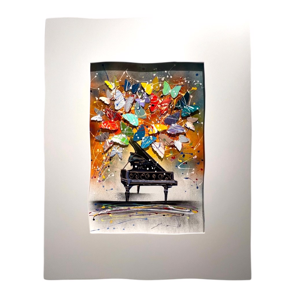Oz El Hai Piano Fantasy: black grand piano beneath colorful dimensional butterflies and paint splashes in a white frame.