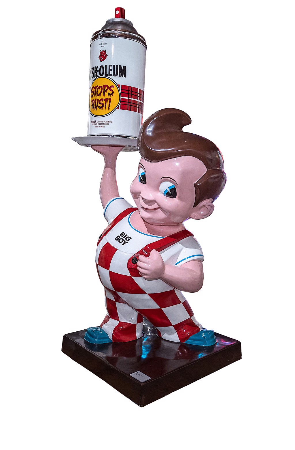 RISK Risky Big Boy sculpture: a smiling figure in red-and-white checked overalls holds a spray can aloft on a tray.