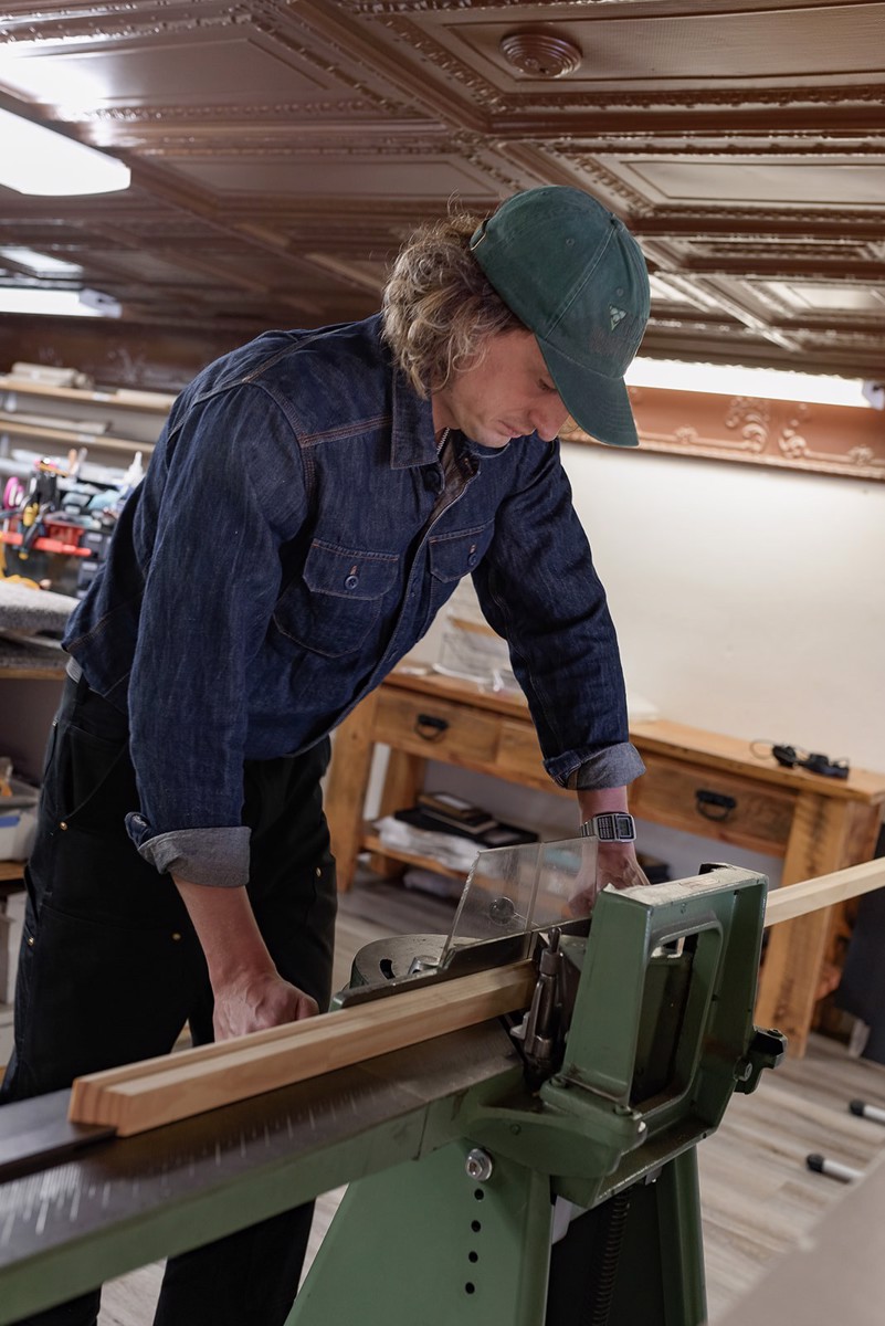 Dane cutting moulding in the frame shop