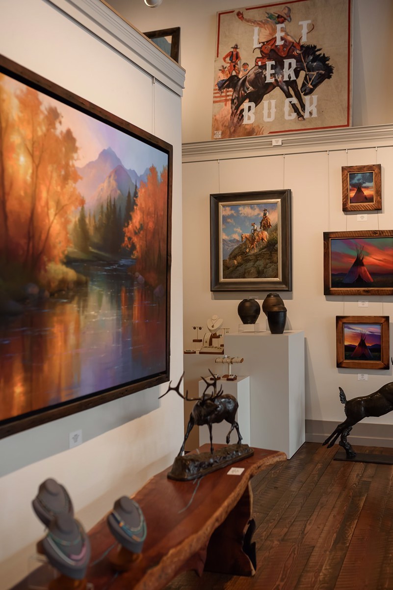 Paintings and bronzes on the gallery wall
