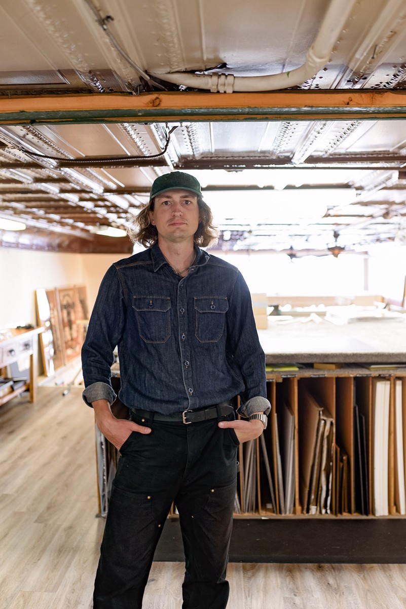 Dane Watt in the frame shop