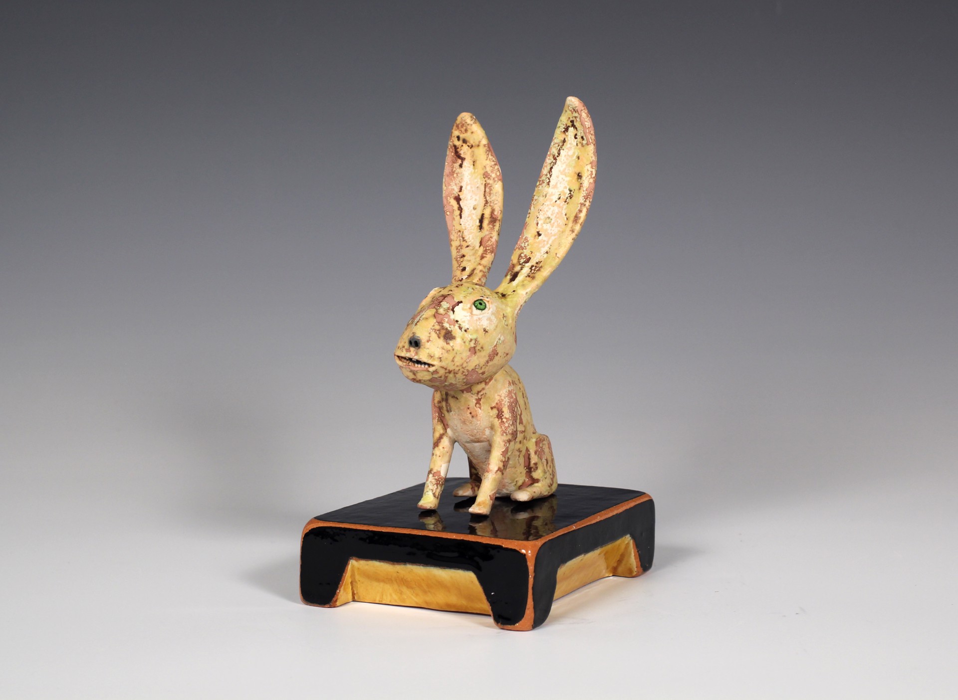 Yellow Rabbit with Black Base by Wesley Anderegg