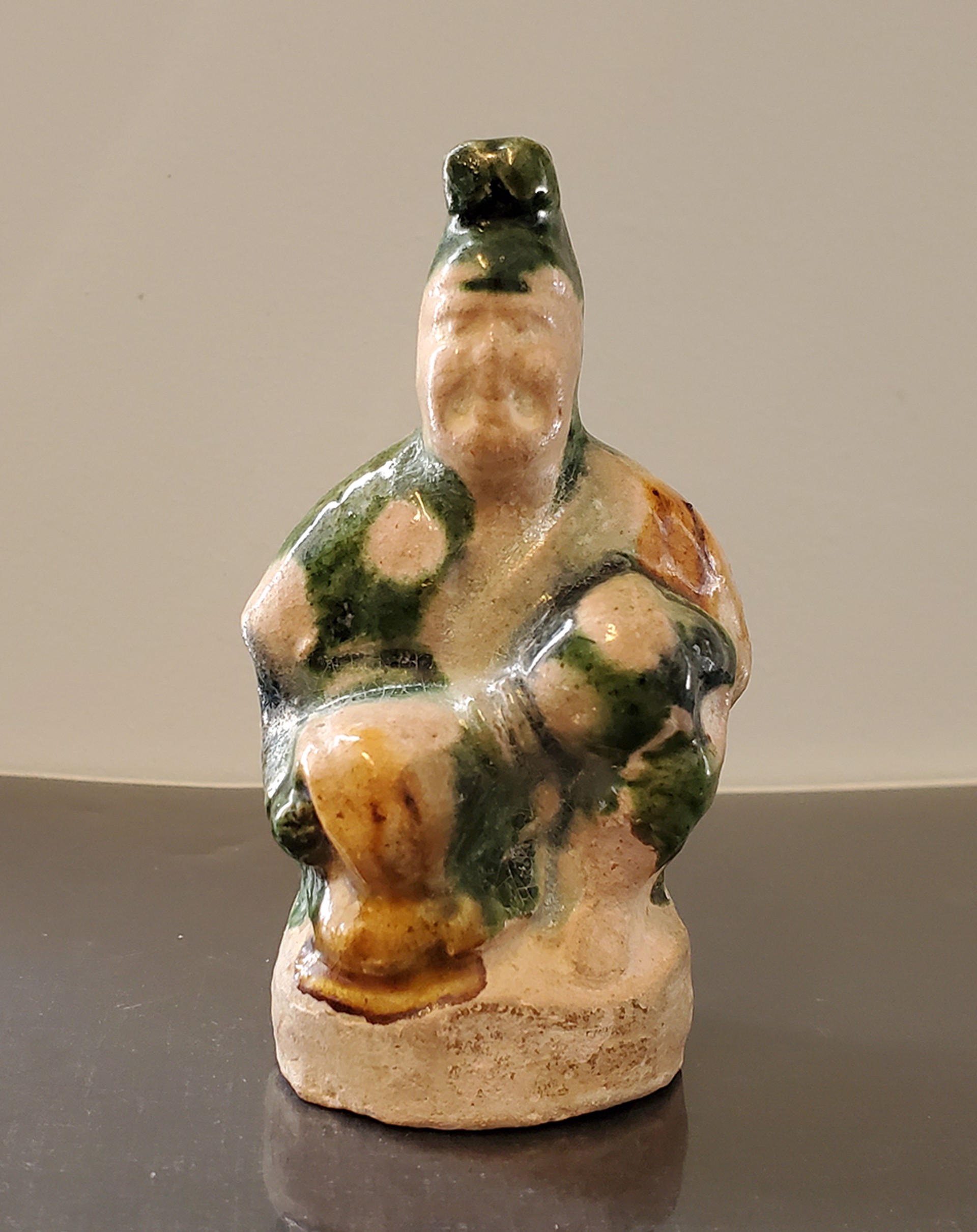 MINIATURE POTTERY GLAZED FIGURE OF A BOY WITH A DRUM