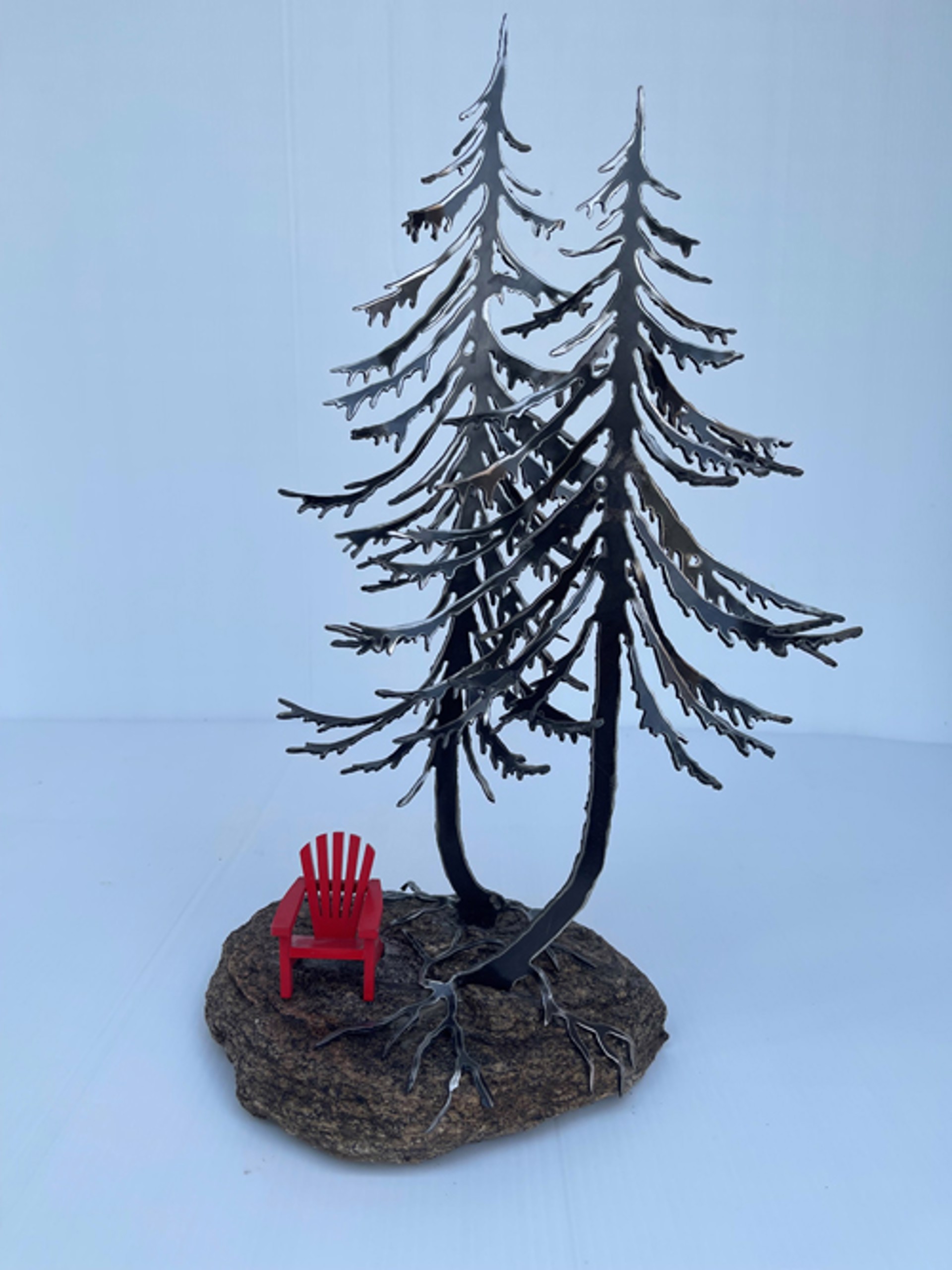 Jack Pines with Red Chair on Rock by Cathy Mark