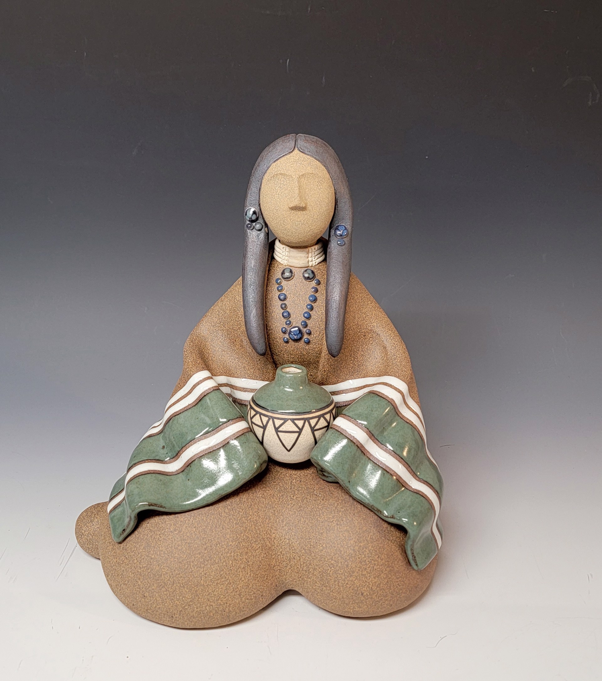 Lakota Woman - Seated by Terry Slonaker