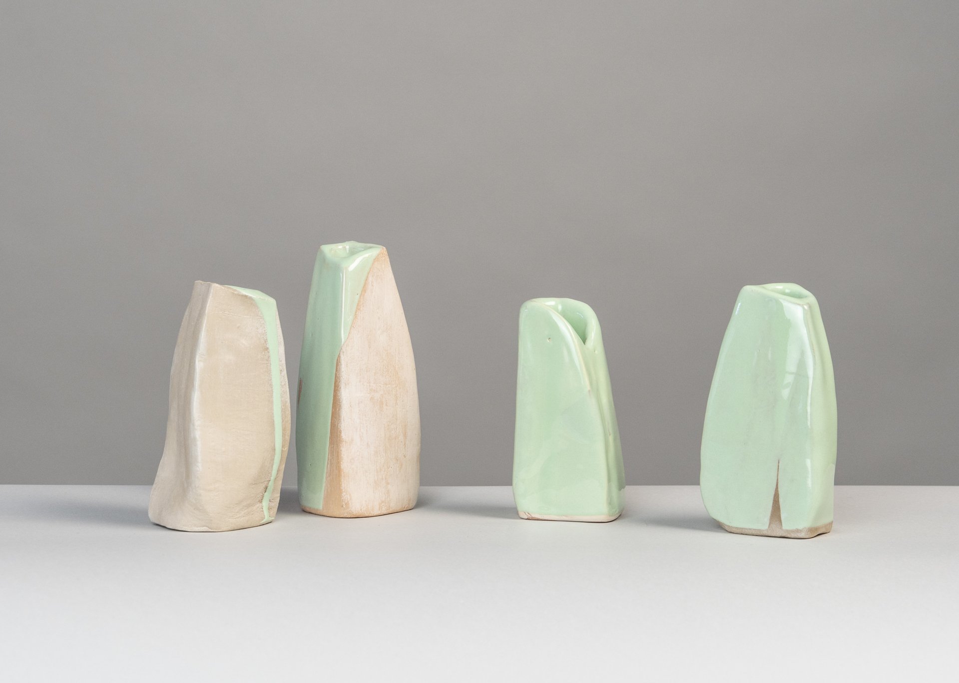 "Springtime" 10 small vases  by Claire de Lavallee