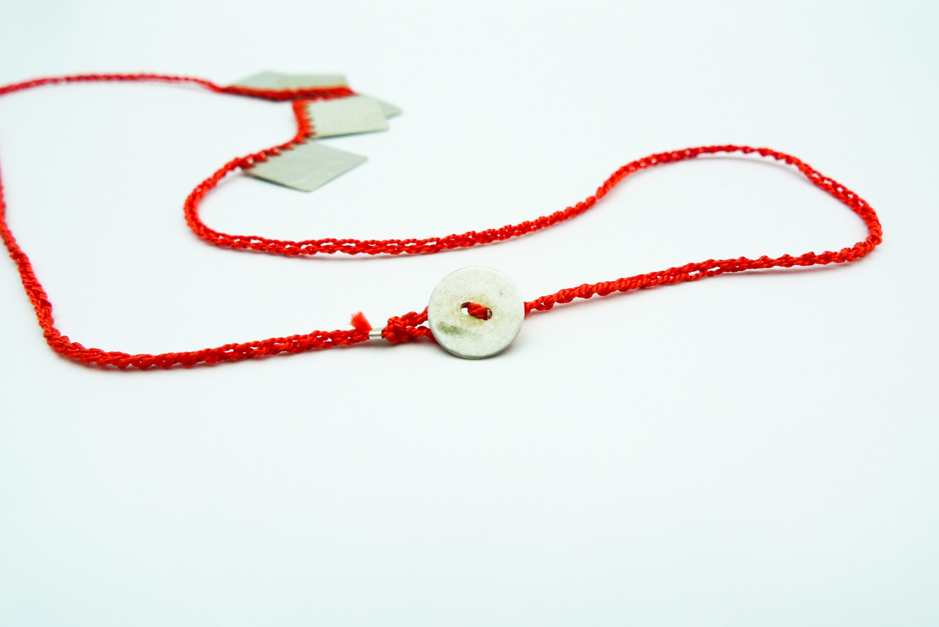 Necklace with Coral Colored Silk Thread by Erica Schlueter