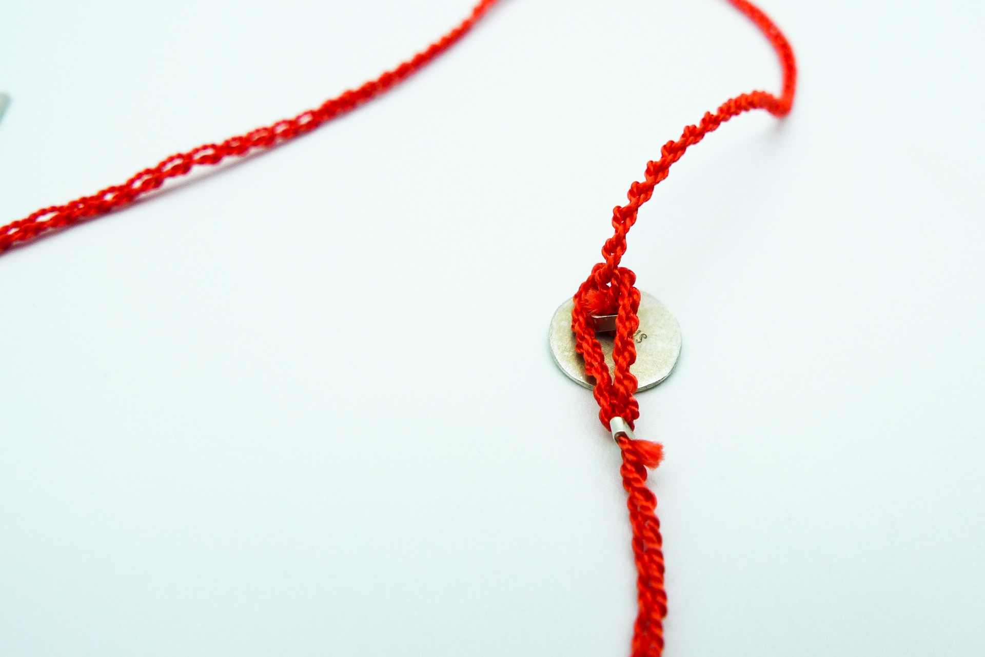 Necklace with Coral Colored Silk Thread by Erica Schlueter
