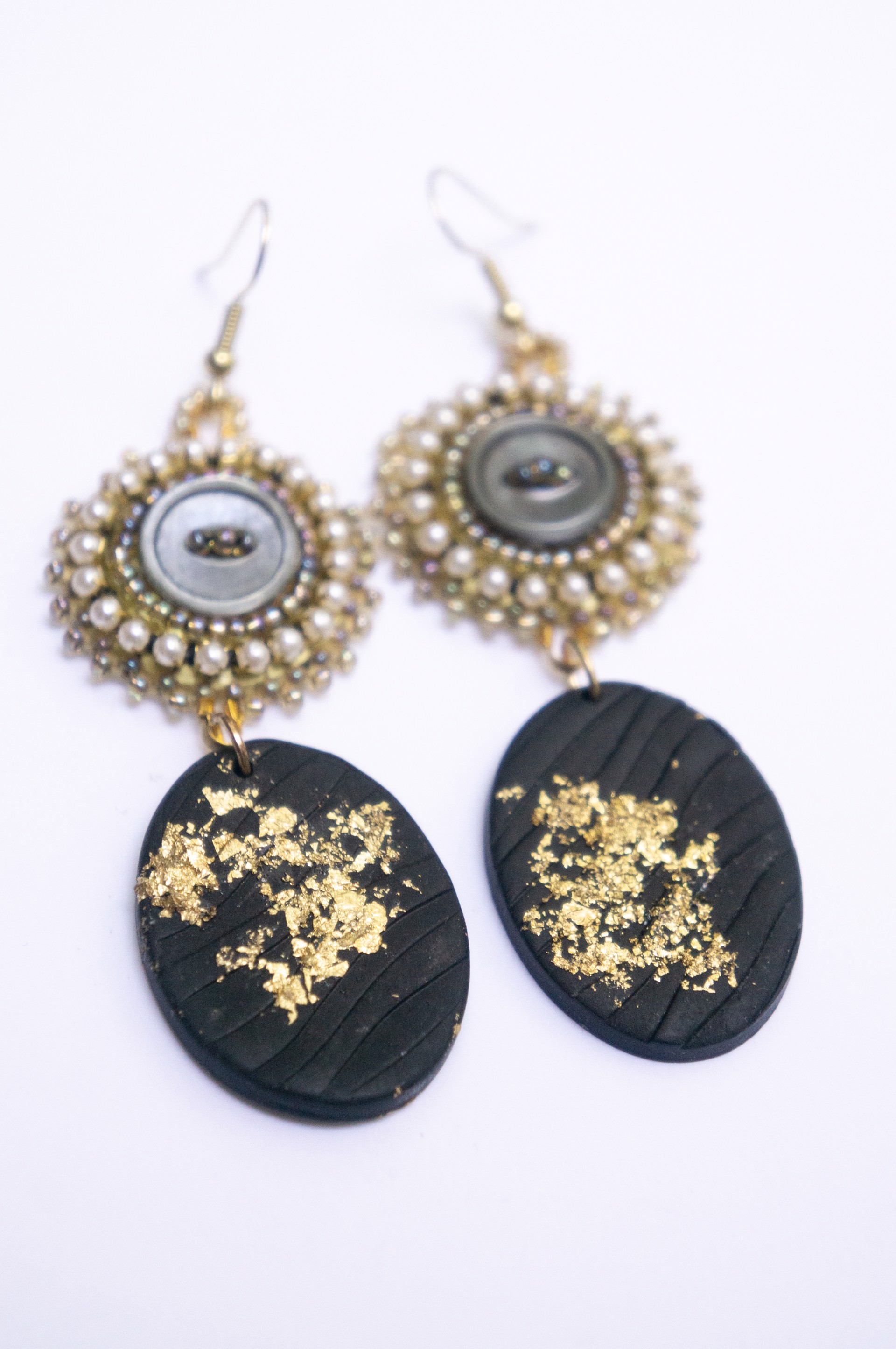 gold and black beaded earrings by Hattie Lee Mendoza