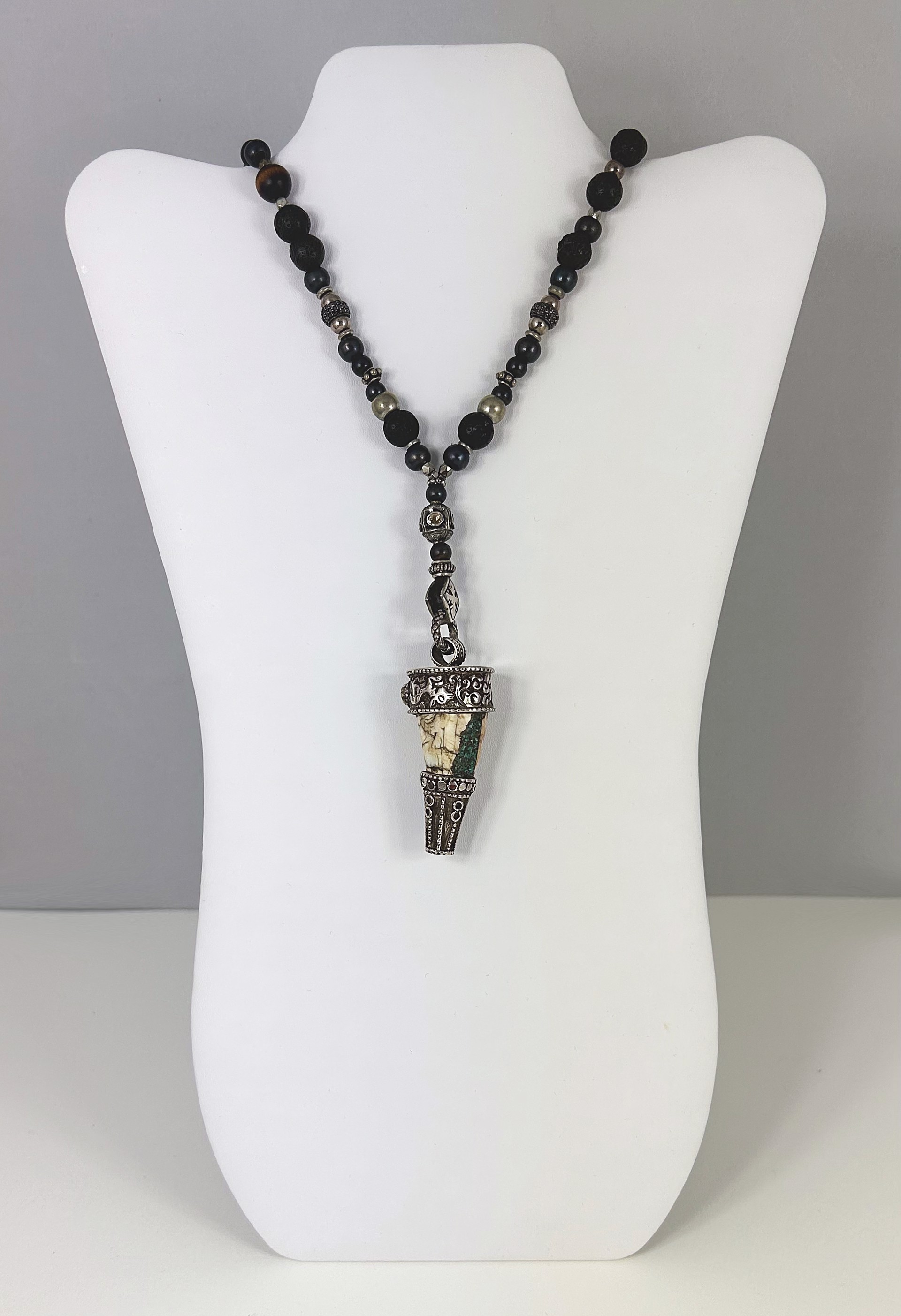 Yak horn necklace with turquoise, diamonds, black pavé spinel beads, lava rock, onyx, wood by Jeri Mitrani