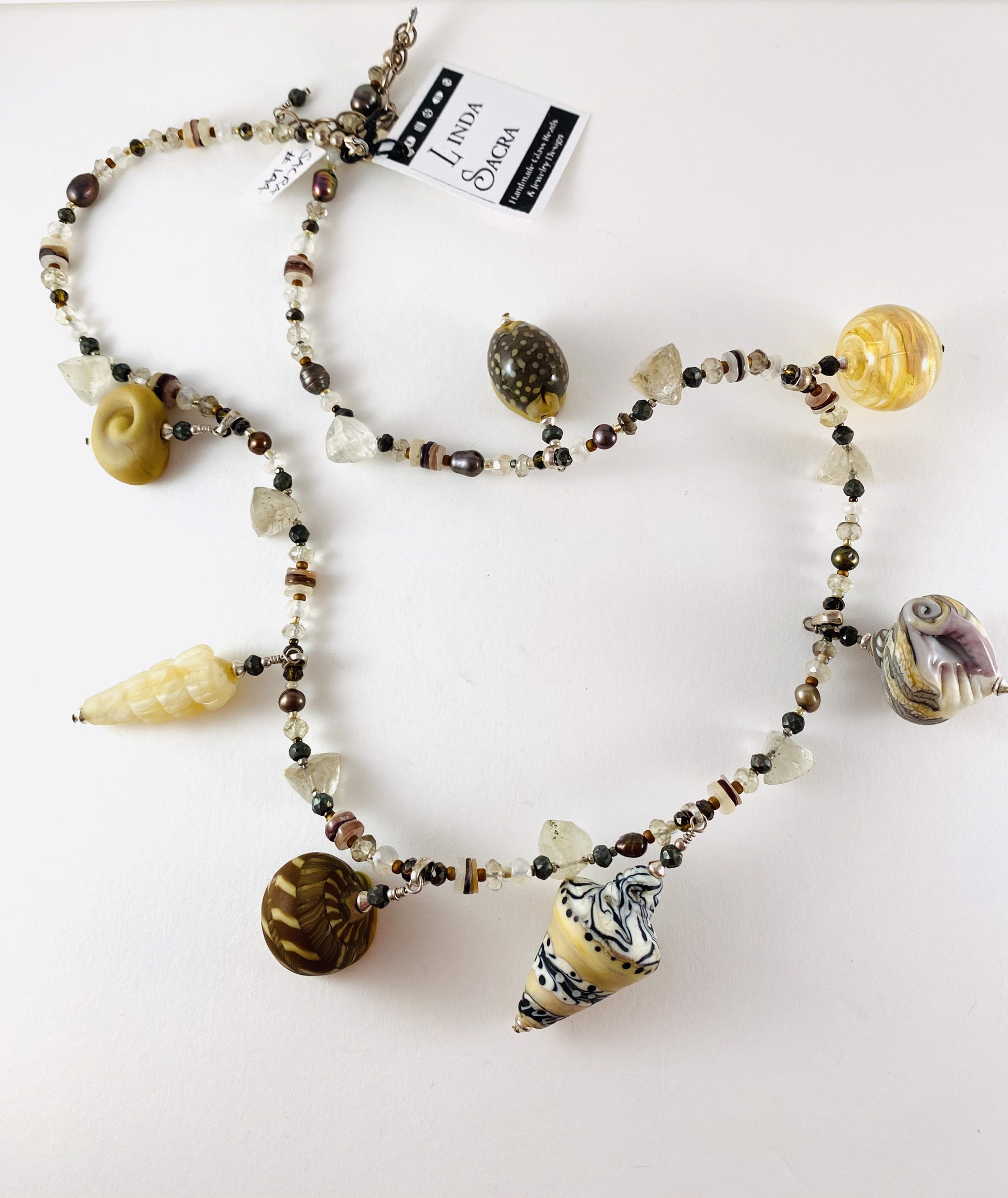 #144 Shells and Beads on Pearl, Gemstone and Rutilated Quartz Trillion Necklace by Linda Sacra