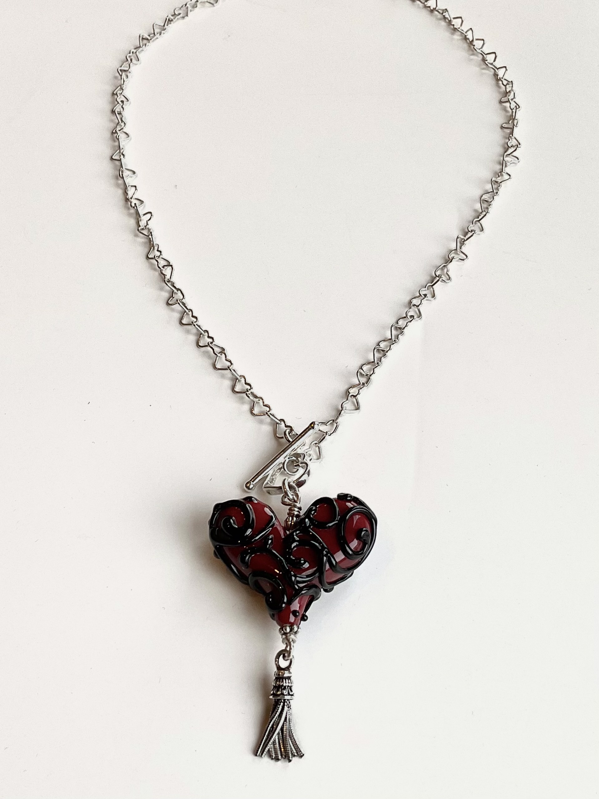 SRSRBST Sm Filigree Red/Black Heart Tassel Necklace by Worn Beadies