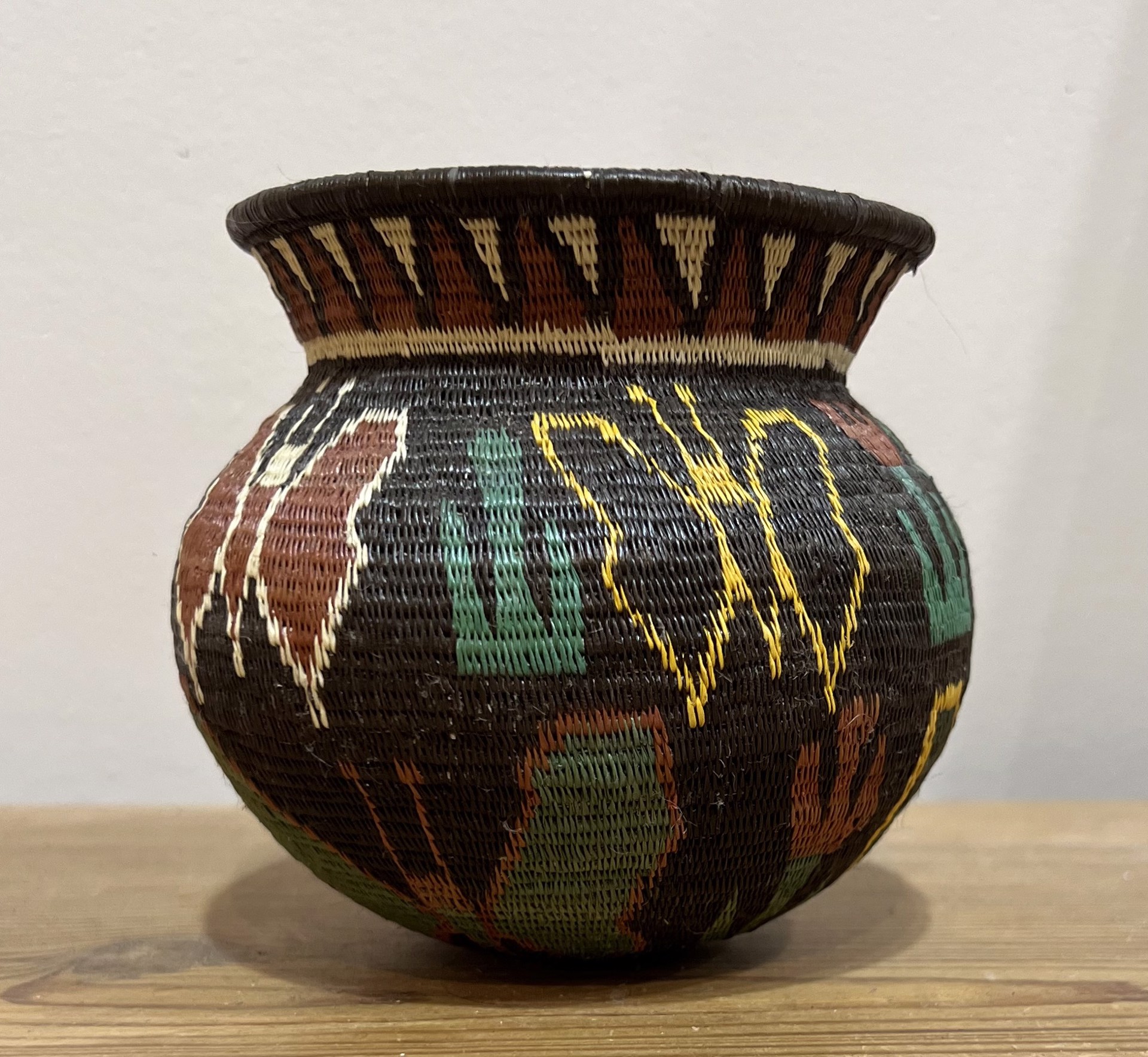 Butterfly basket with dark background by Wounaan & Embera Panama Rainforest Baskets Wounaan