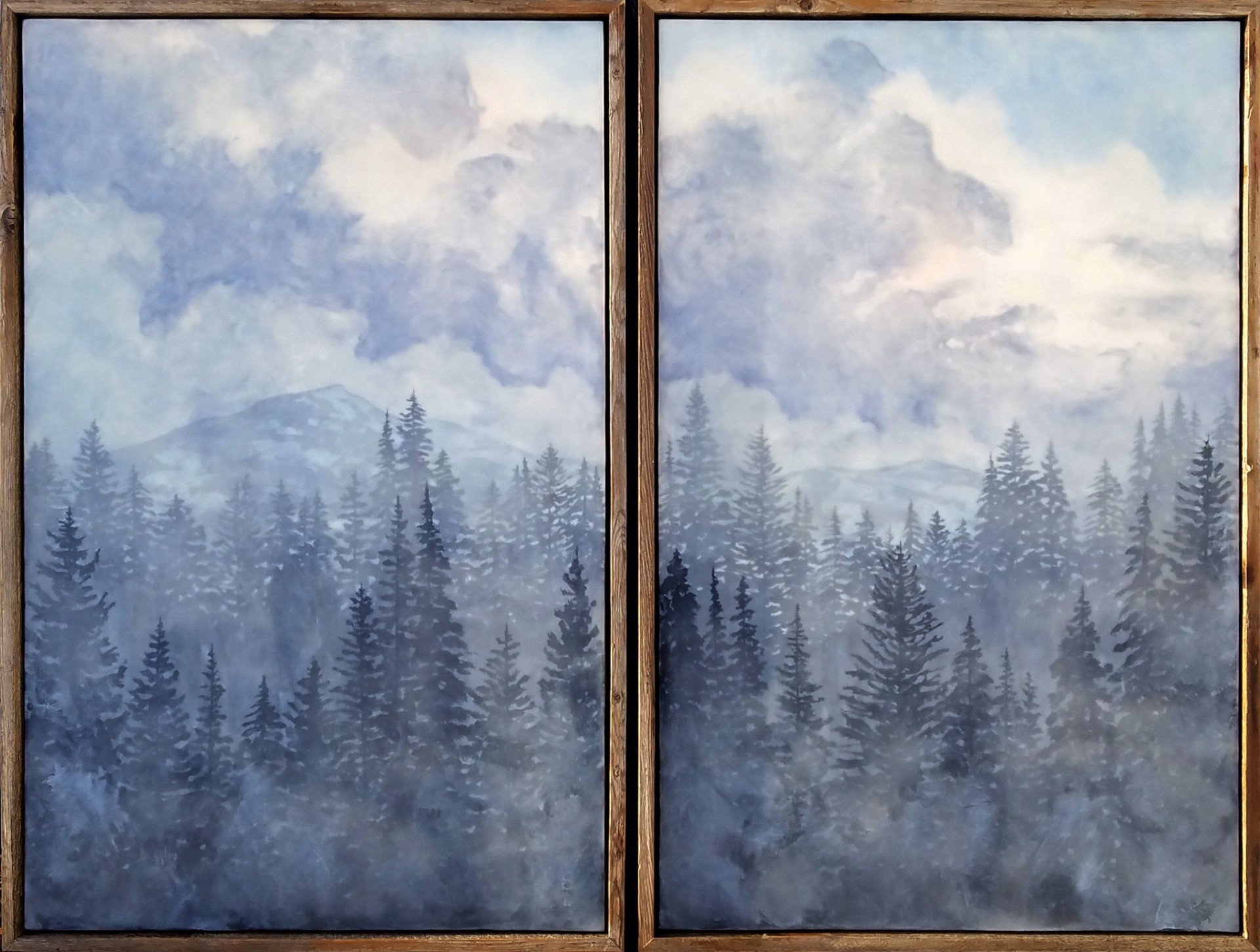 An Original Encaustic And Milk Paint Diptych Painting Of A Misty Treed Landscape With Blue Cloudy Sky Above Mountains And Layered Depth Of Trees, By Bridgette Meinhold