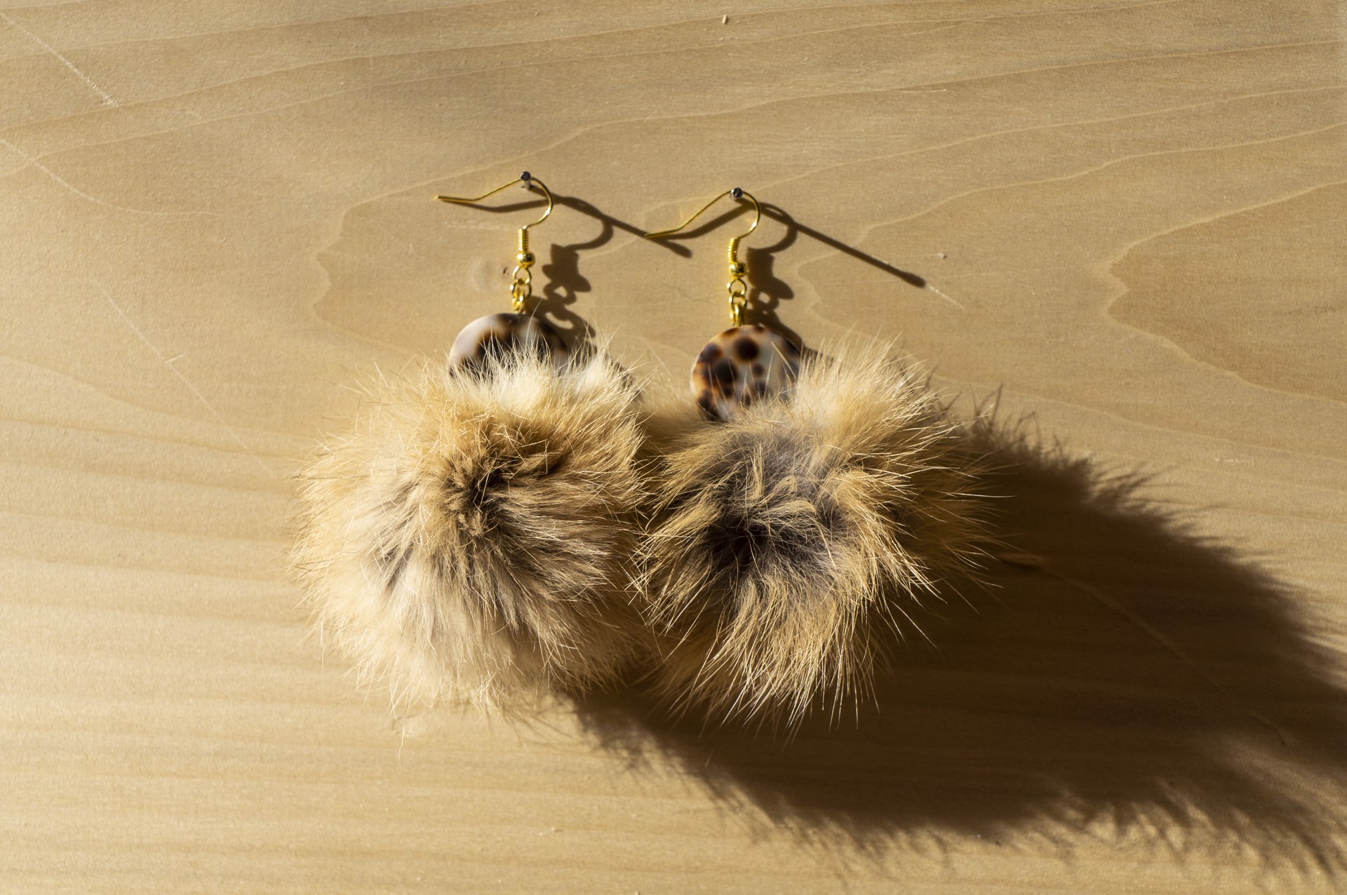 Shell and fur earrings by Hattie Lee Mendoza