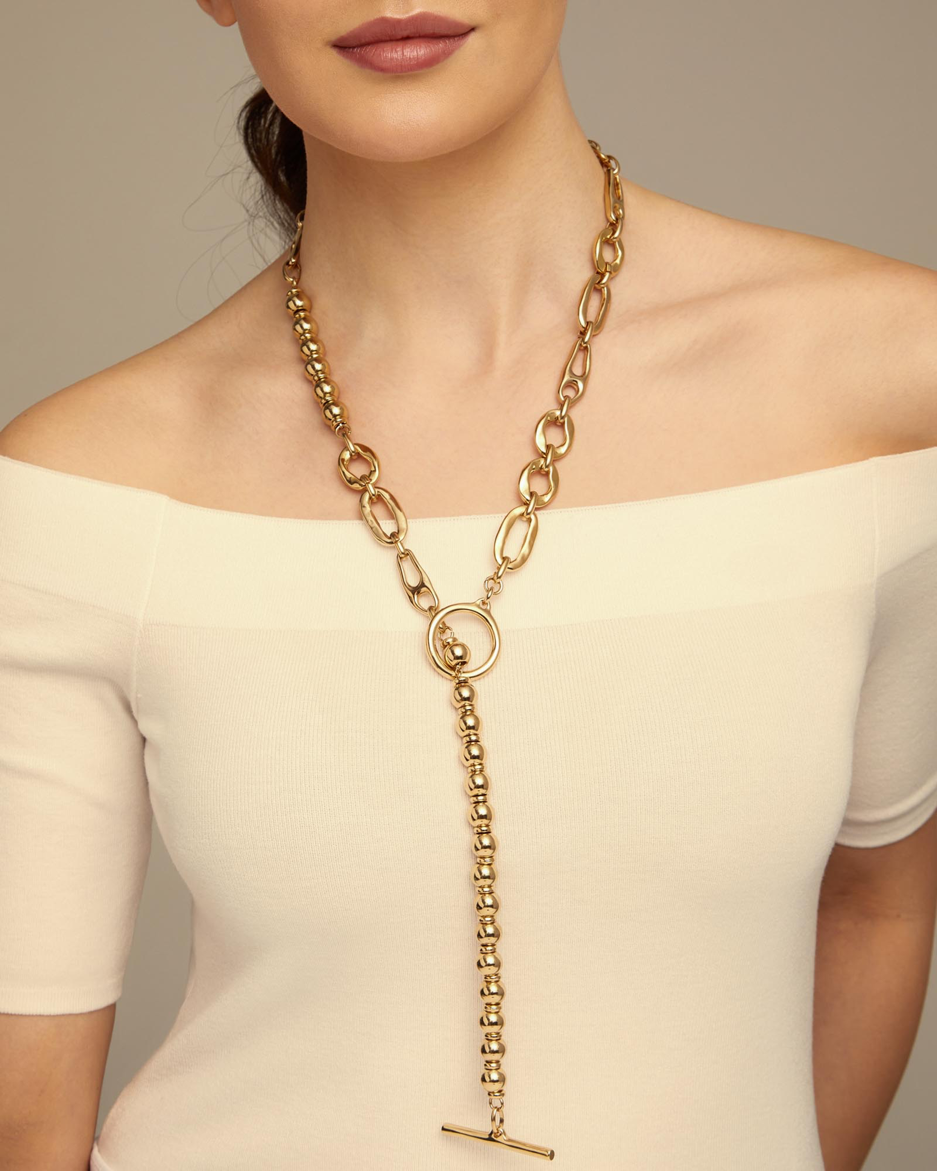Versatile Gold “Yolo” Necklace by UNO DE 50