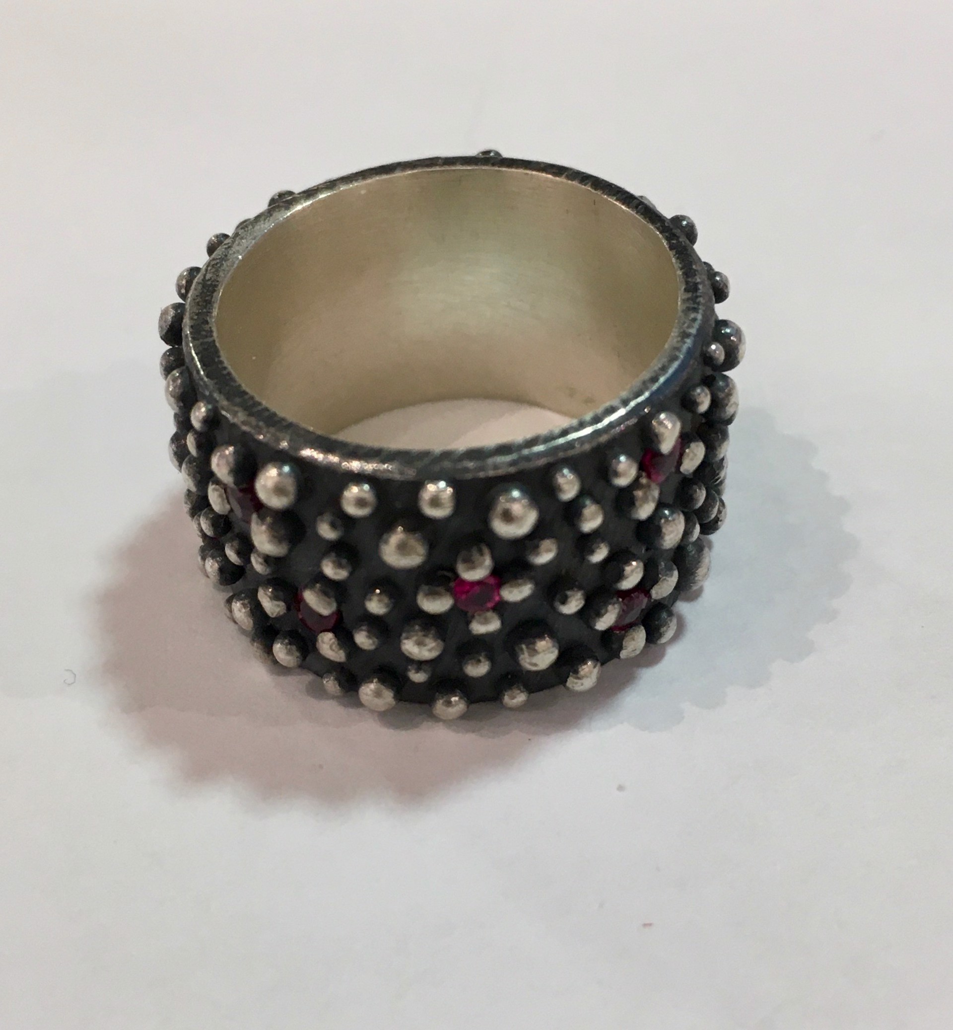 Oxidized Silver Band Wide with Rubies by DAHLIA KANNER