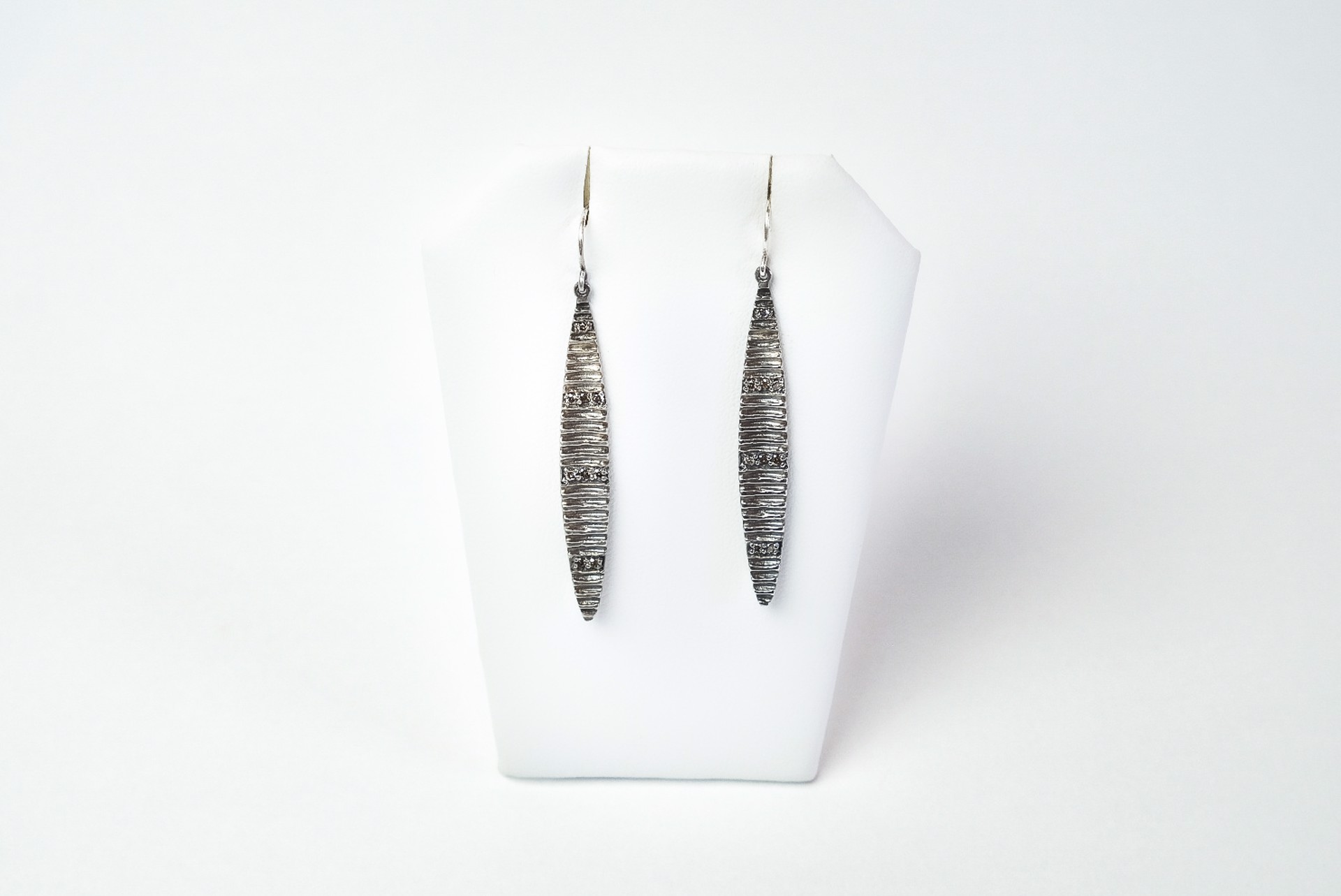 Faceted diamond drop earrings by Jeri Mitrani