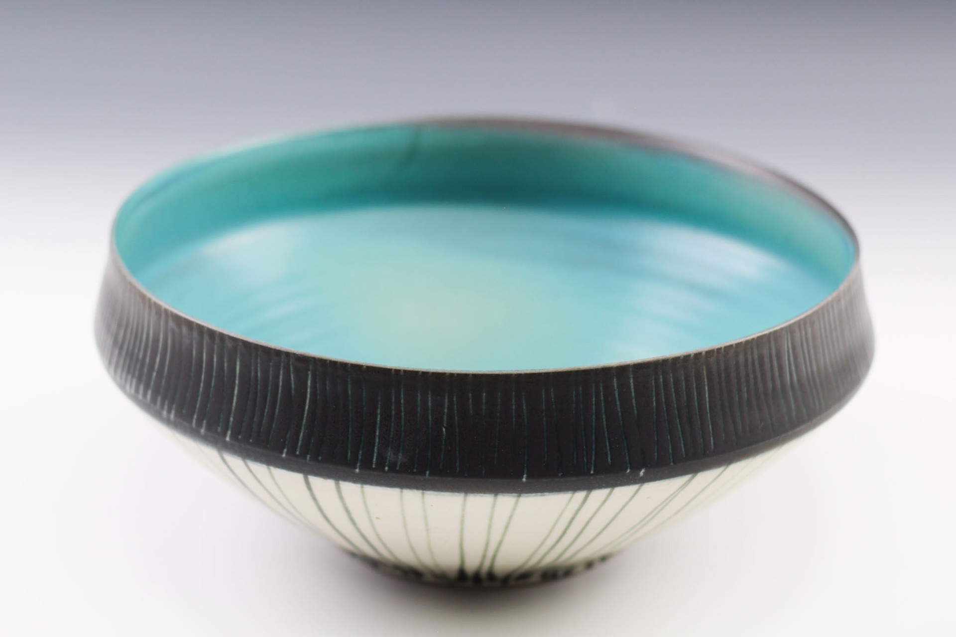Medium Black Rim Bowl by Delores Fortuna