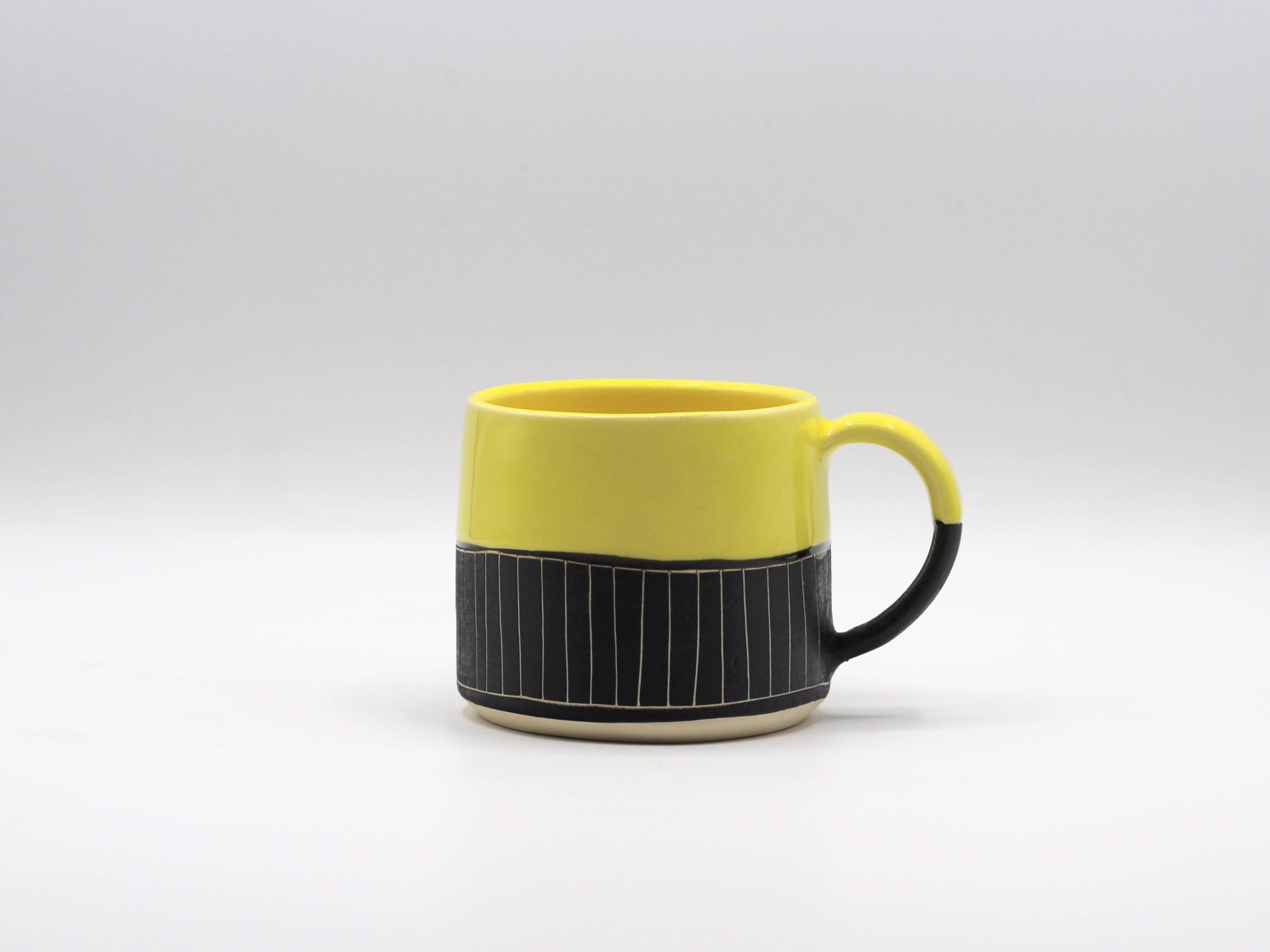 B&W Geometric w/ Yellow Glaze Mug by Kara Lovell