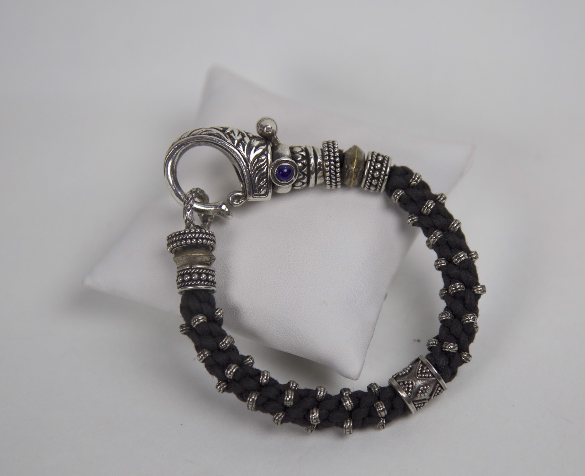 Black braided wax cord with cabochon sapphire by Jeri Mitrani
