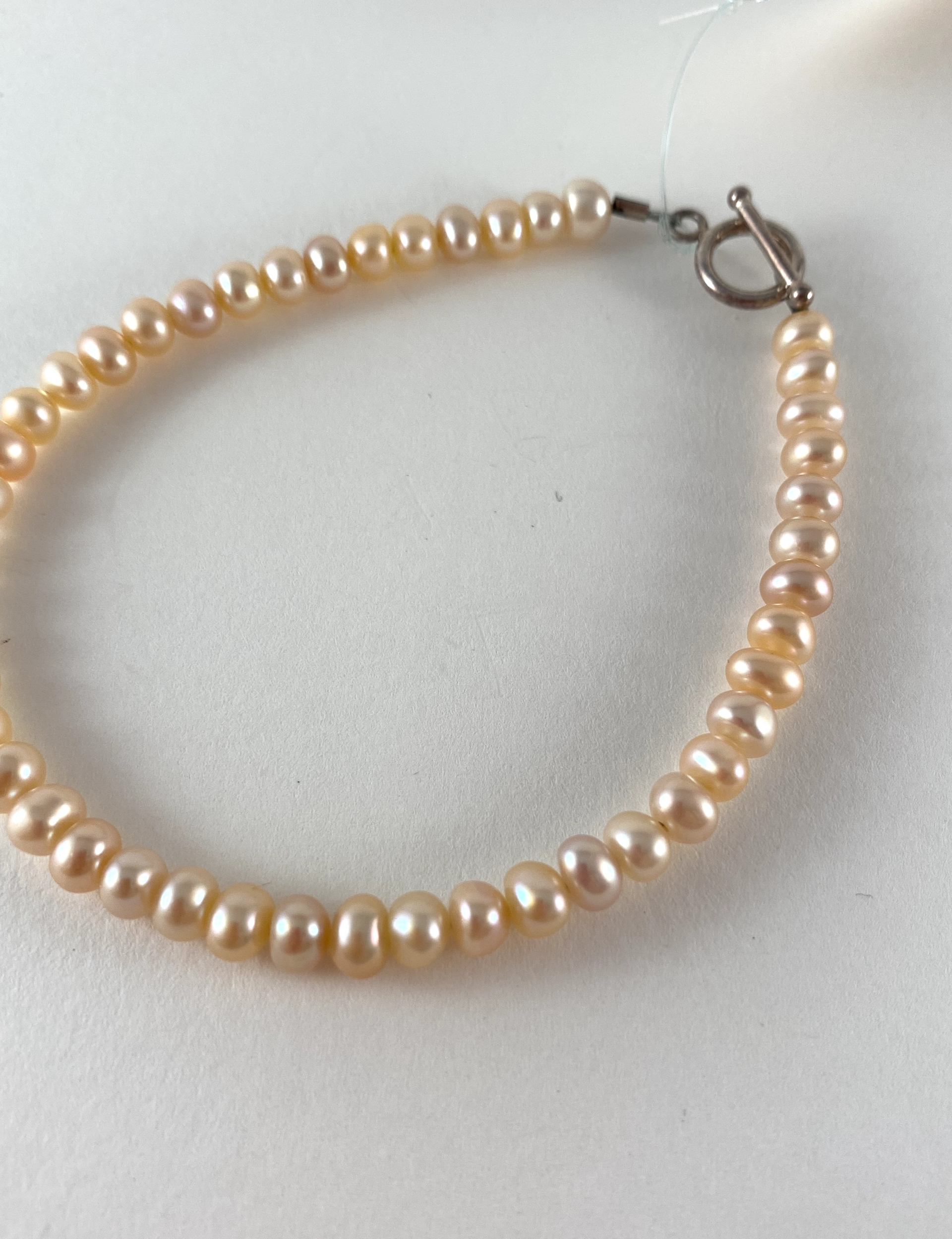 Peach Button Pearl Bracelet, toggle clasp P6 by Nance Trueworthy